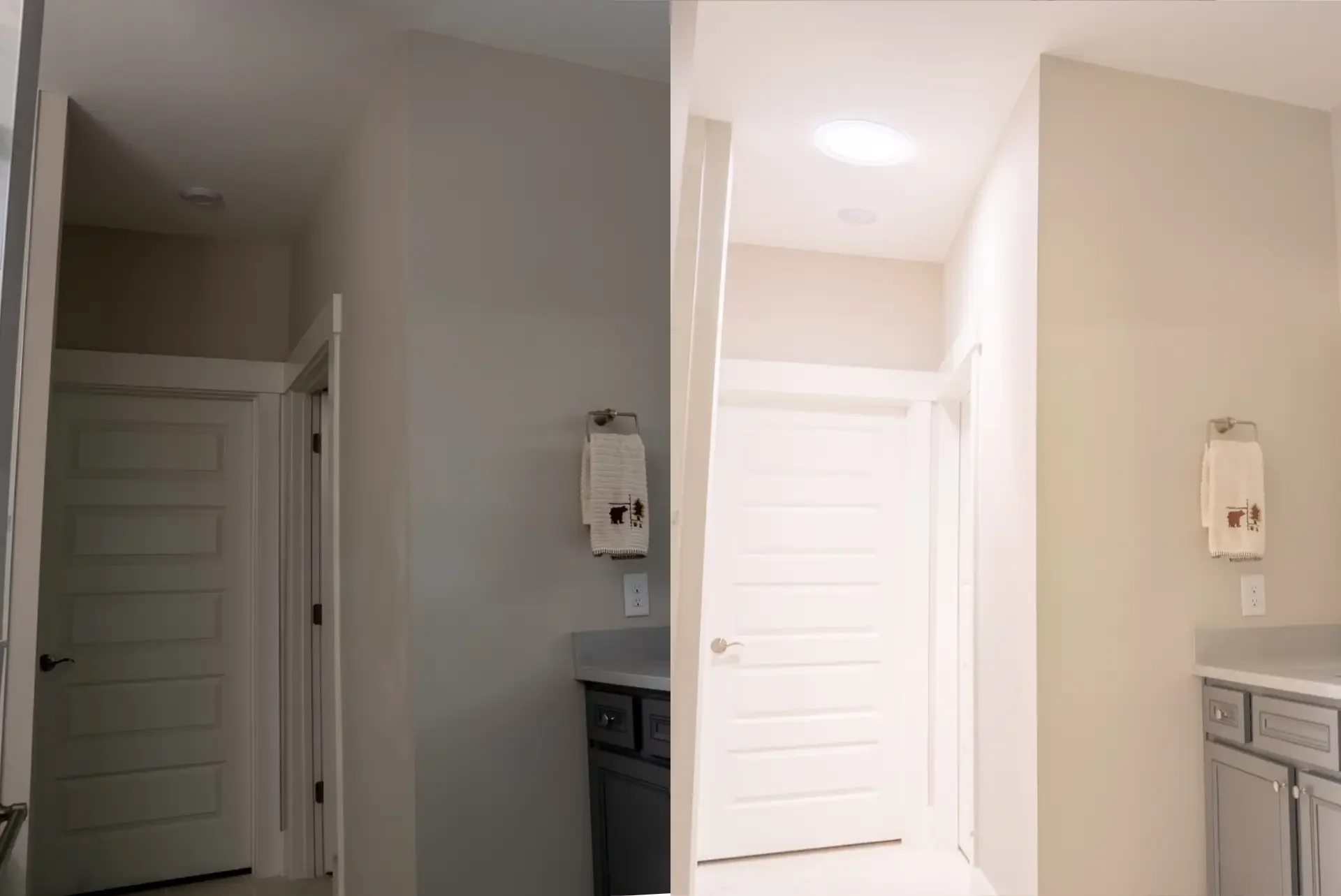Interior view of a modern kitchen with white cabinets, beige walls, and a white door. Two white towels with bear designs are hanging on the wall. The image is upside down.