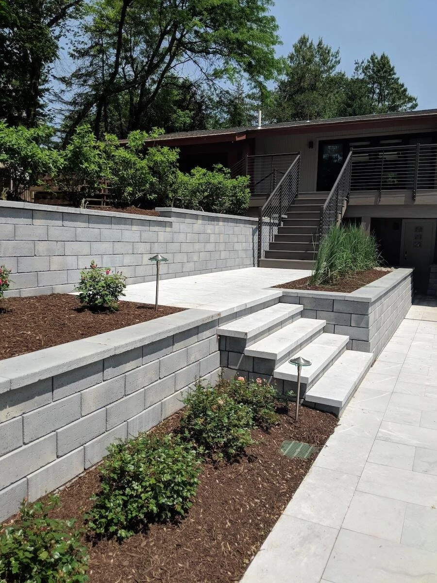 Multi-tiered retaining wall design with natural stone in Tappahannock, VA.jpg