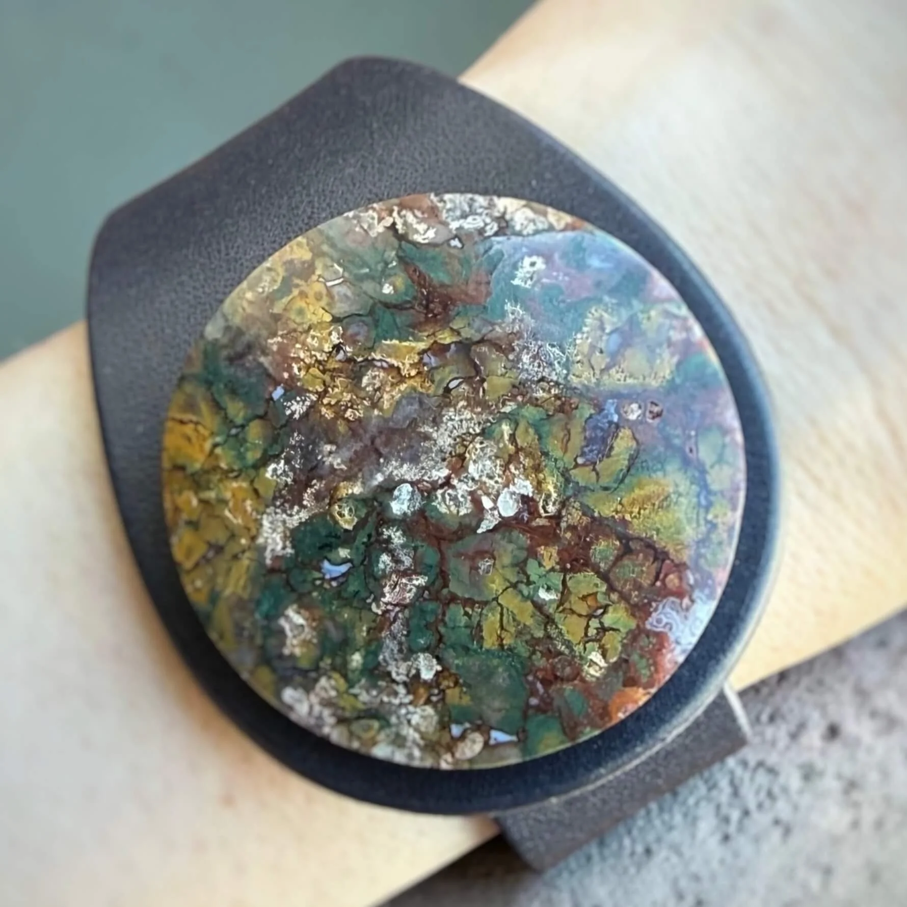 natural-indonesian-plume-agate-blue-leather-bracelet-worn-on-wrist.jpg