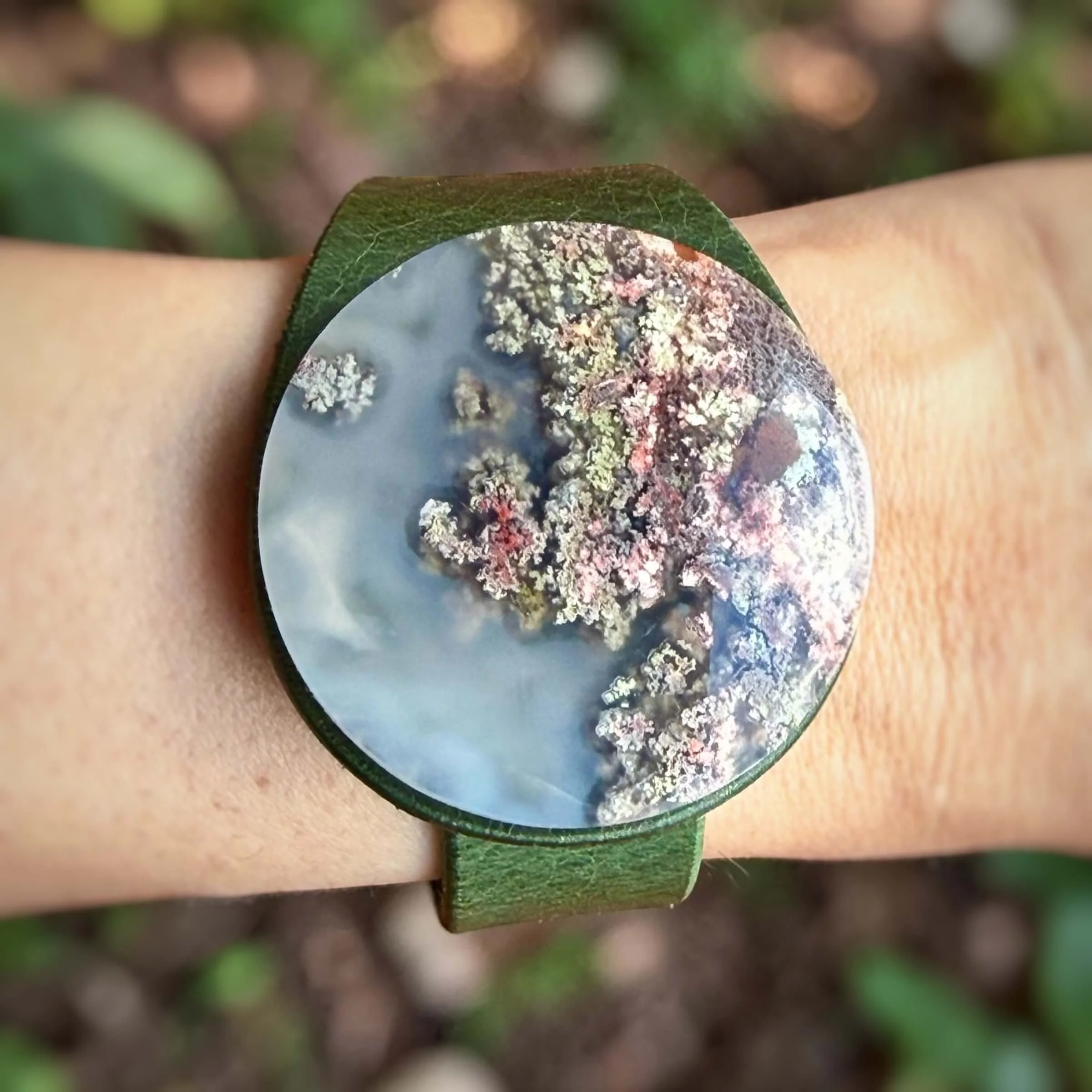 natural-scenic-moss-agate-green-leather-bracelet-on-wrist-close-up.jpg