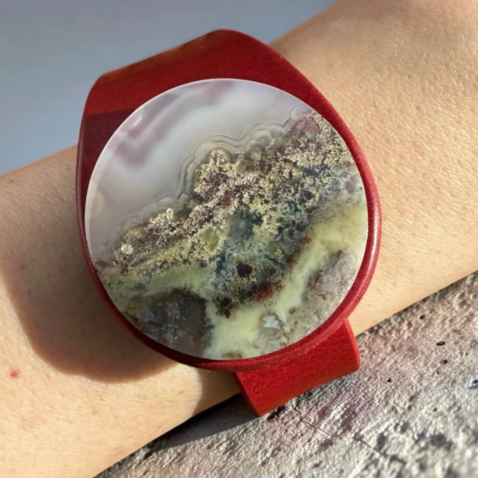 natural-scenic-moss-agate-red-leather-bracelet-on-wrist.jpg
