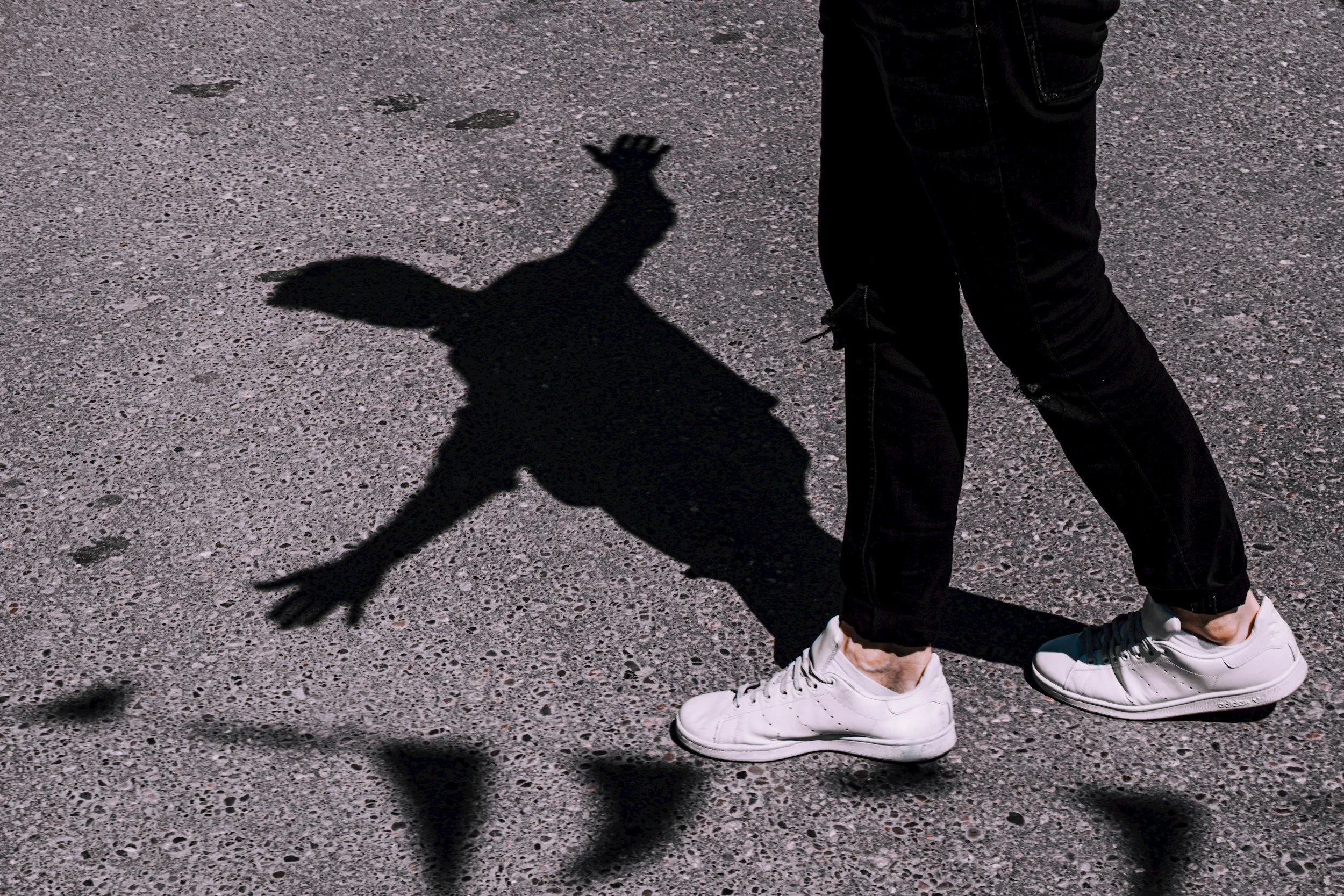 A person balancing with a shadow