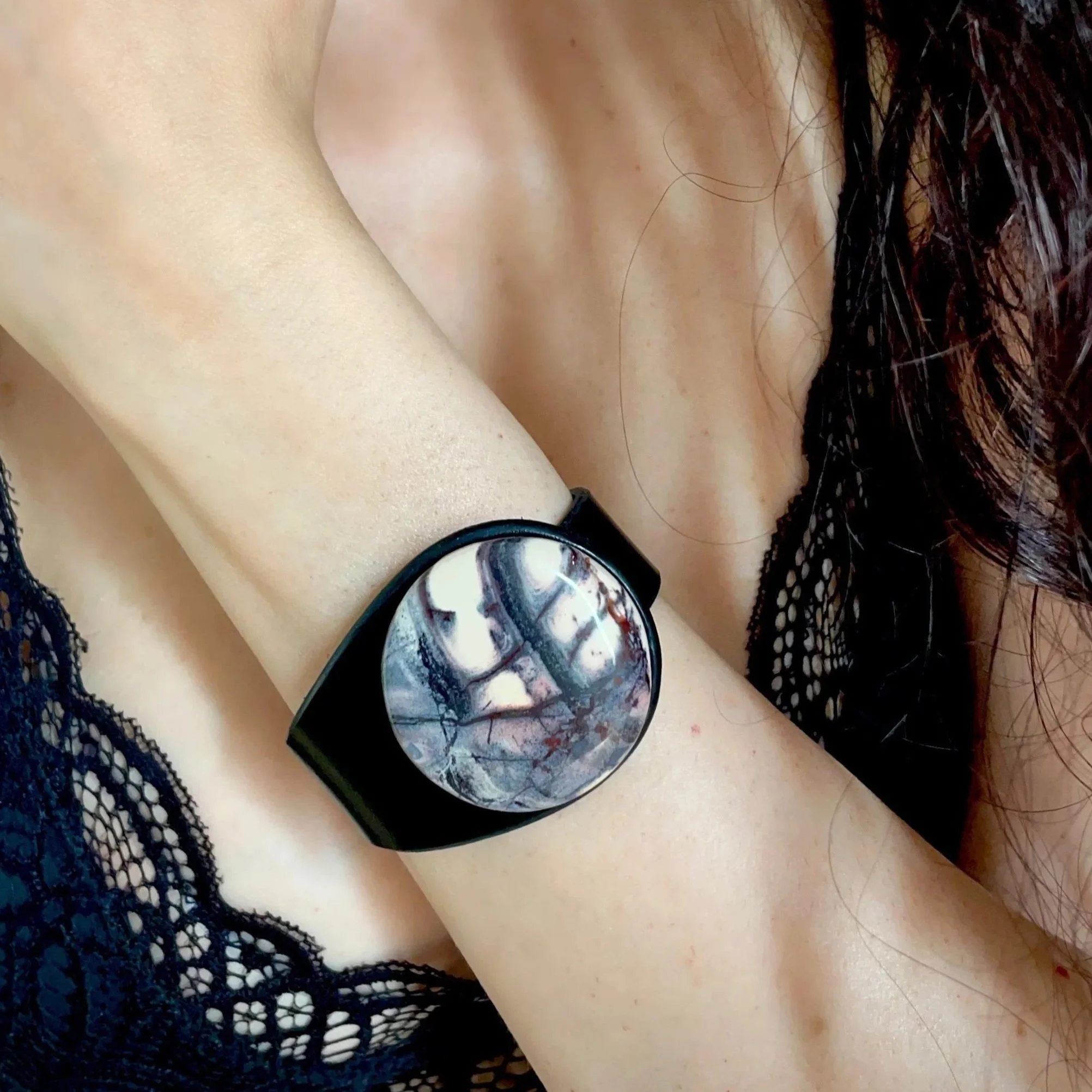 A woman wearing a Natural Porcelain Jasper Gemstone & Leather Cuff