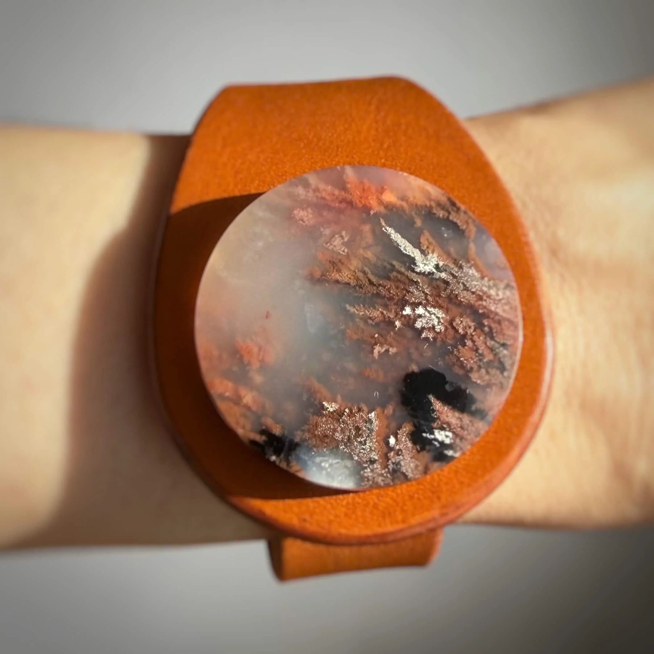 natural-plume-agate-tan-leather-bracelet-on-wrist-close-up.jpg