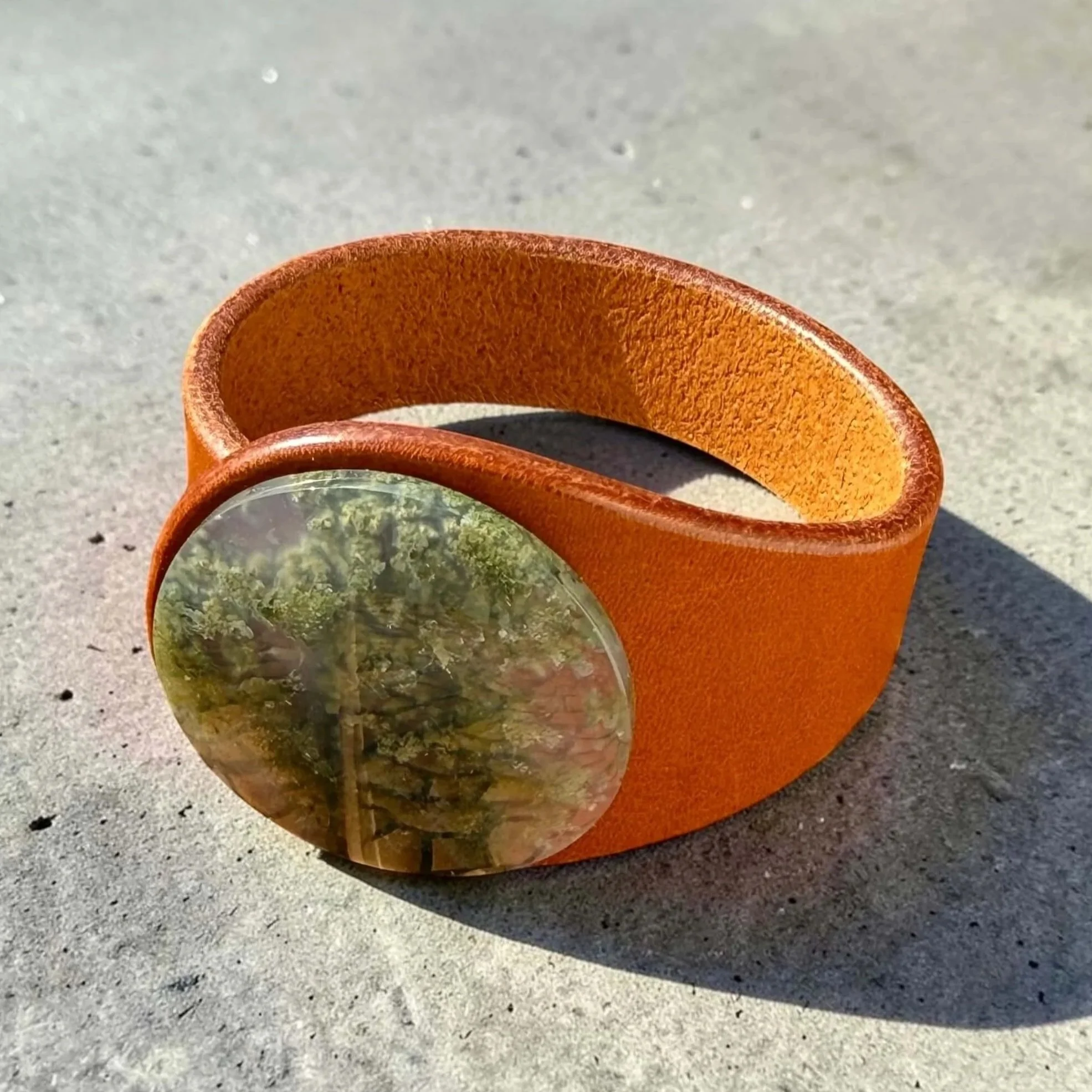 Scenic-moss-agate-light-brown-leather-bracelet-on-side.jpg