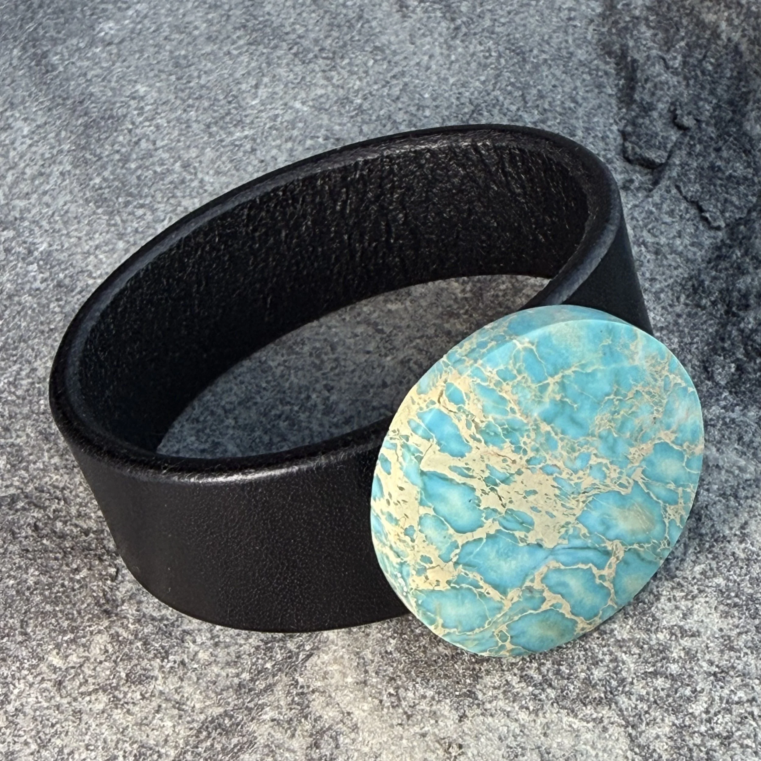 natural-sea-sediment-jasper-black-leather-bracelet-on-side.jpeg