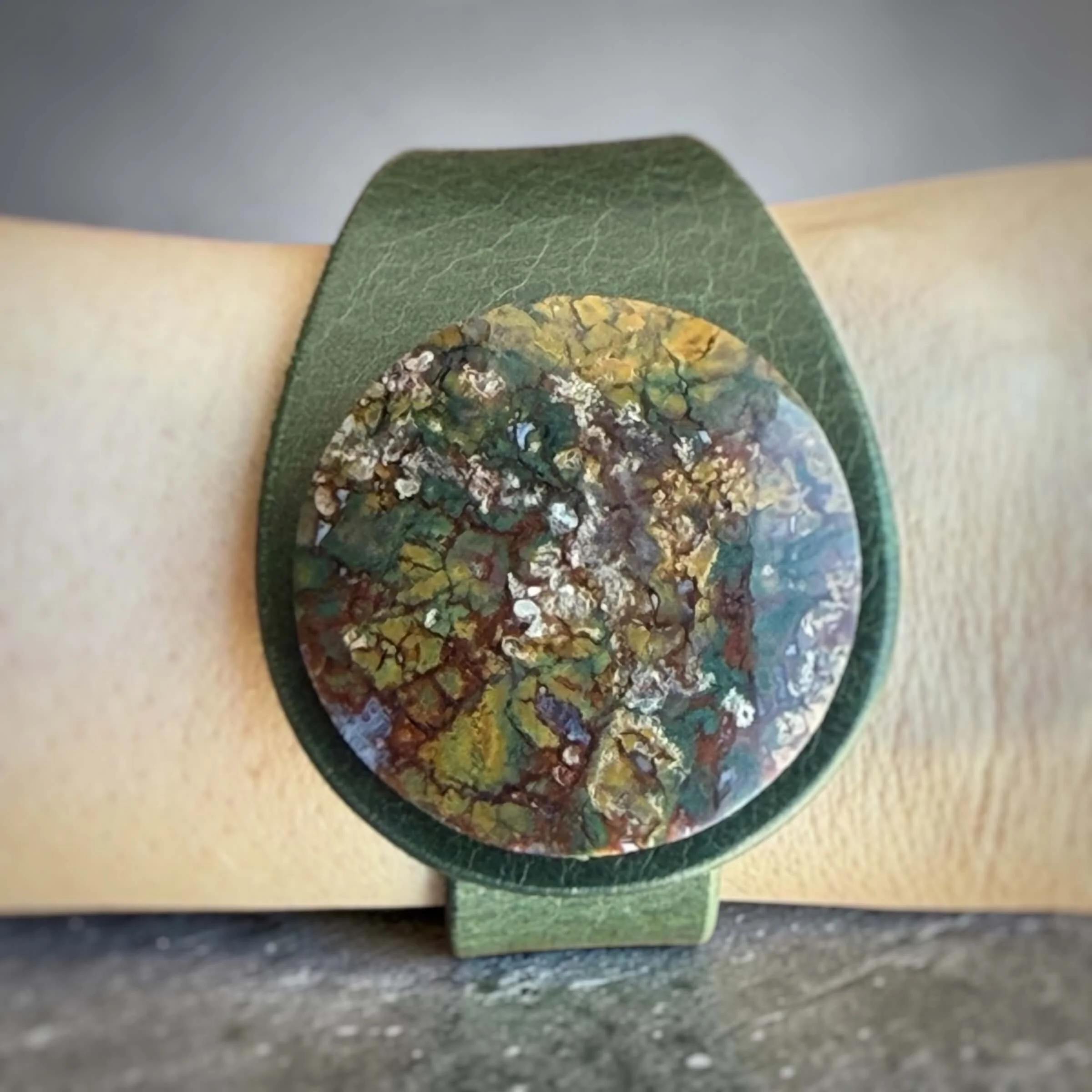 natural-indonesian-plume-agate-green-leather-bracelet-wrist-close-up.jpg