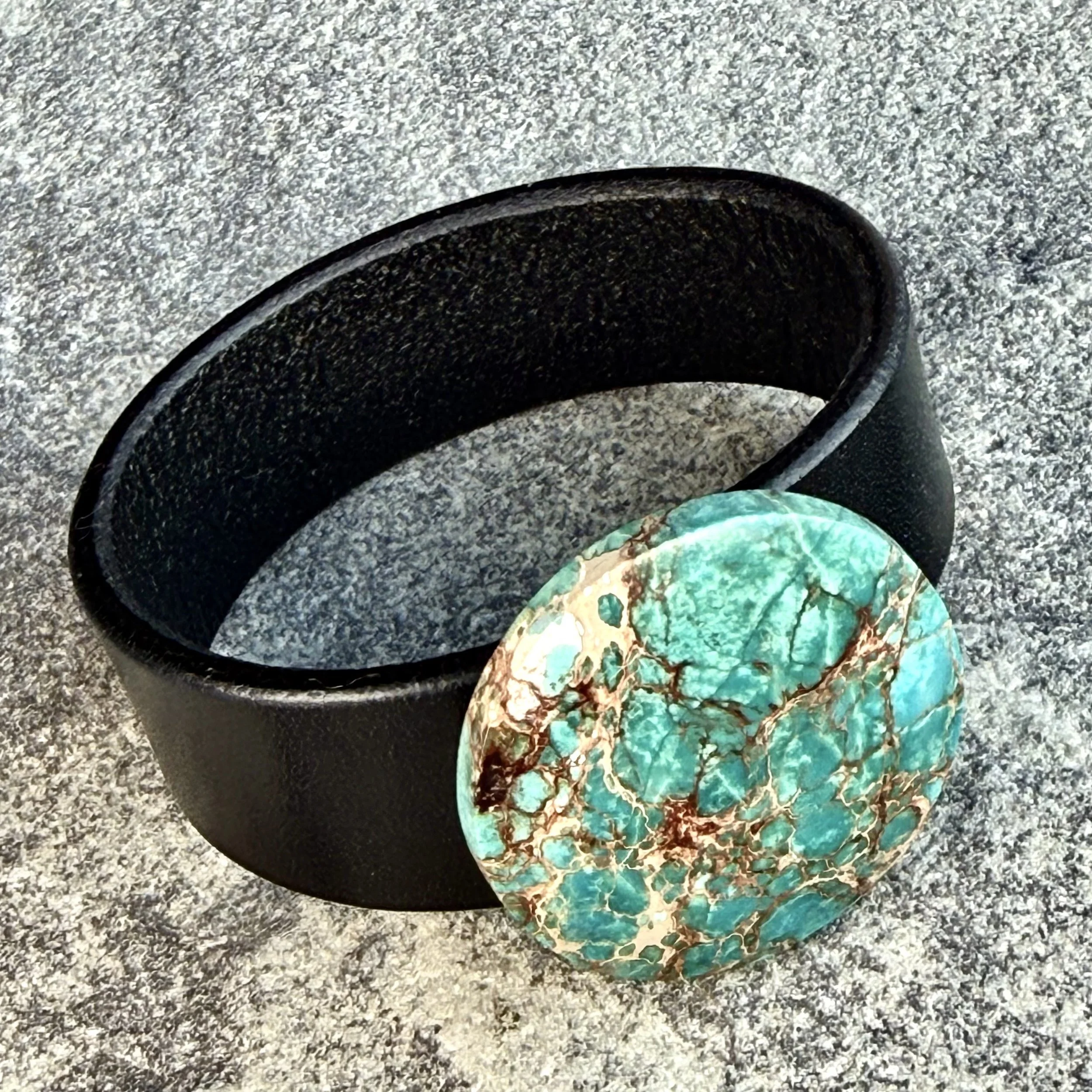 sea-sediment-jasper-black-leather-bracelet-on-side.jpeg