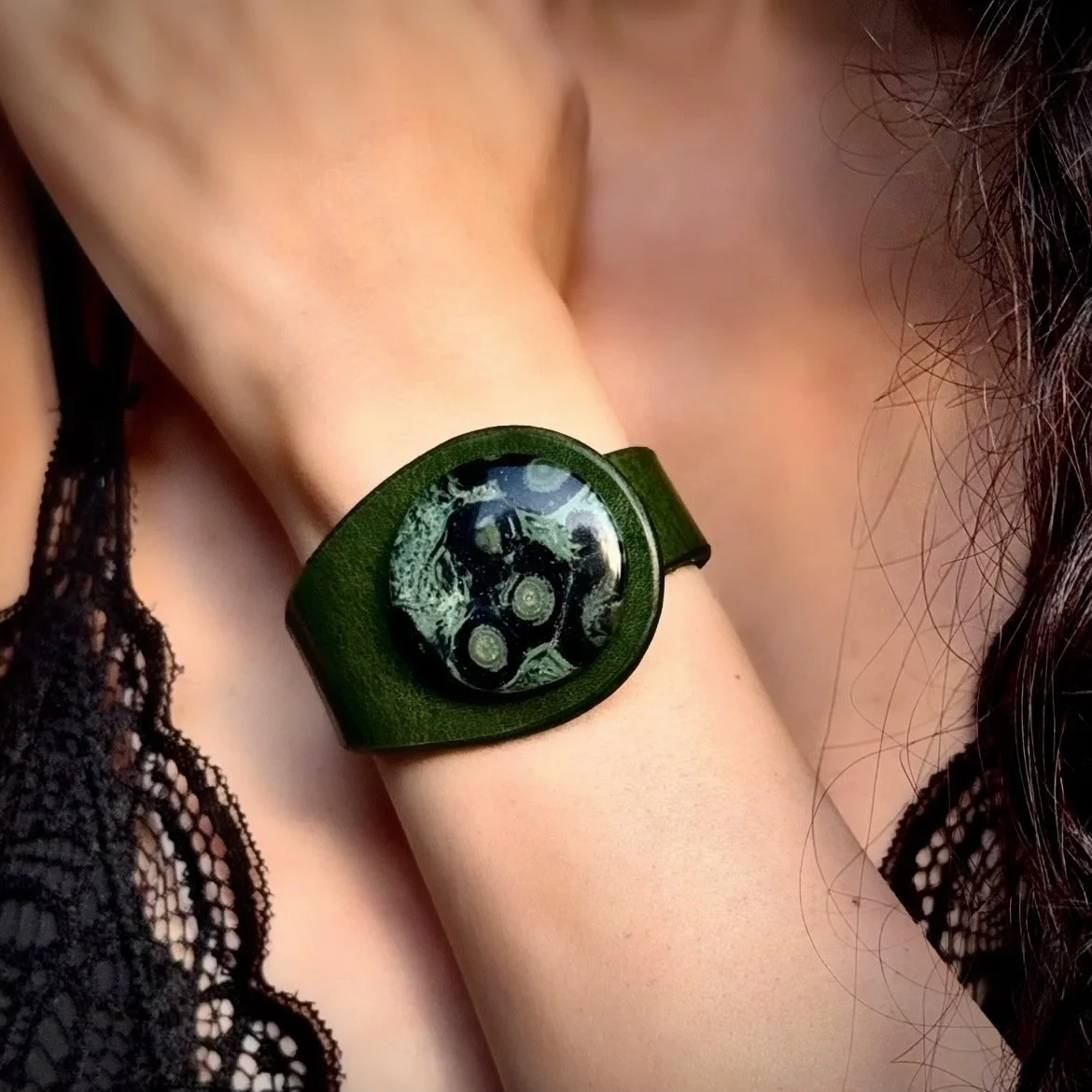 A woman wearing a Natural Star Galaxy Jasper Gemstone & Leather Cuff