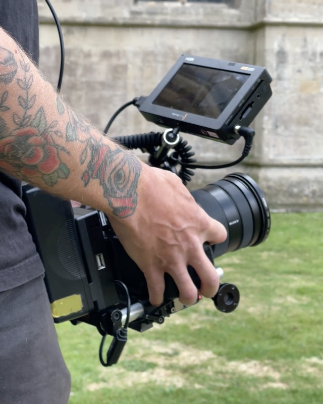 Hands holding a video camera