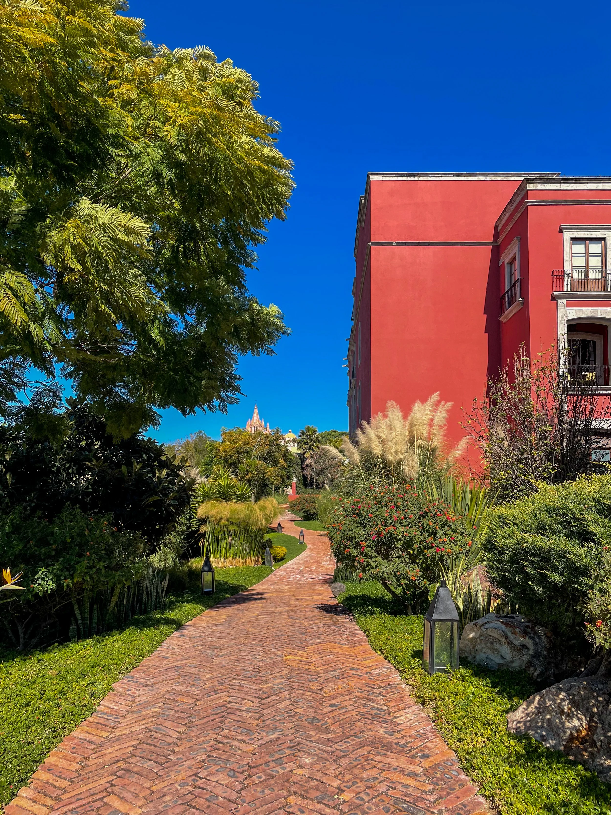 Walkway with colorful building inside the Rosewood in San Miguel de Allende, Mexico