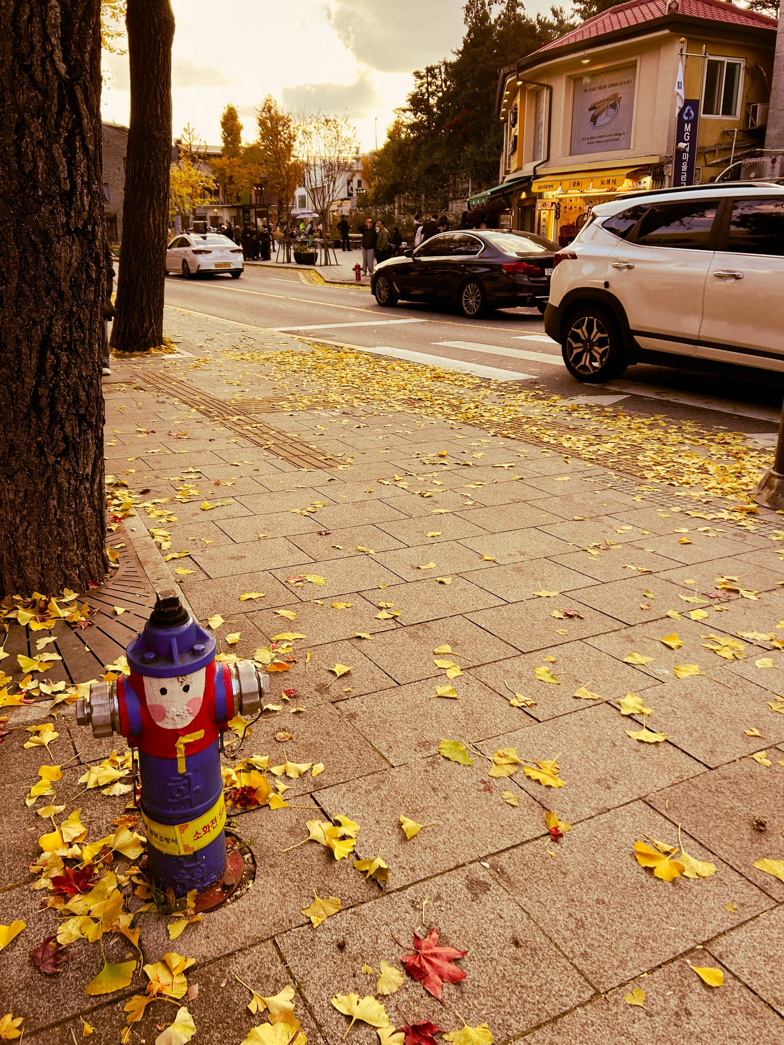 playful fire hydrant on Seoul street, painted like a little fireman figure