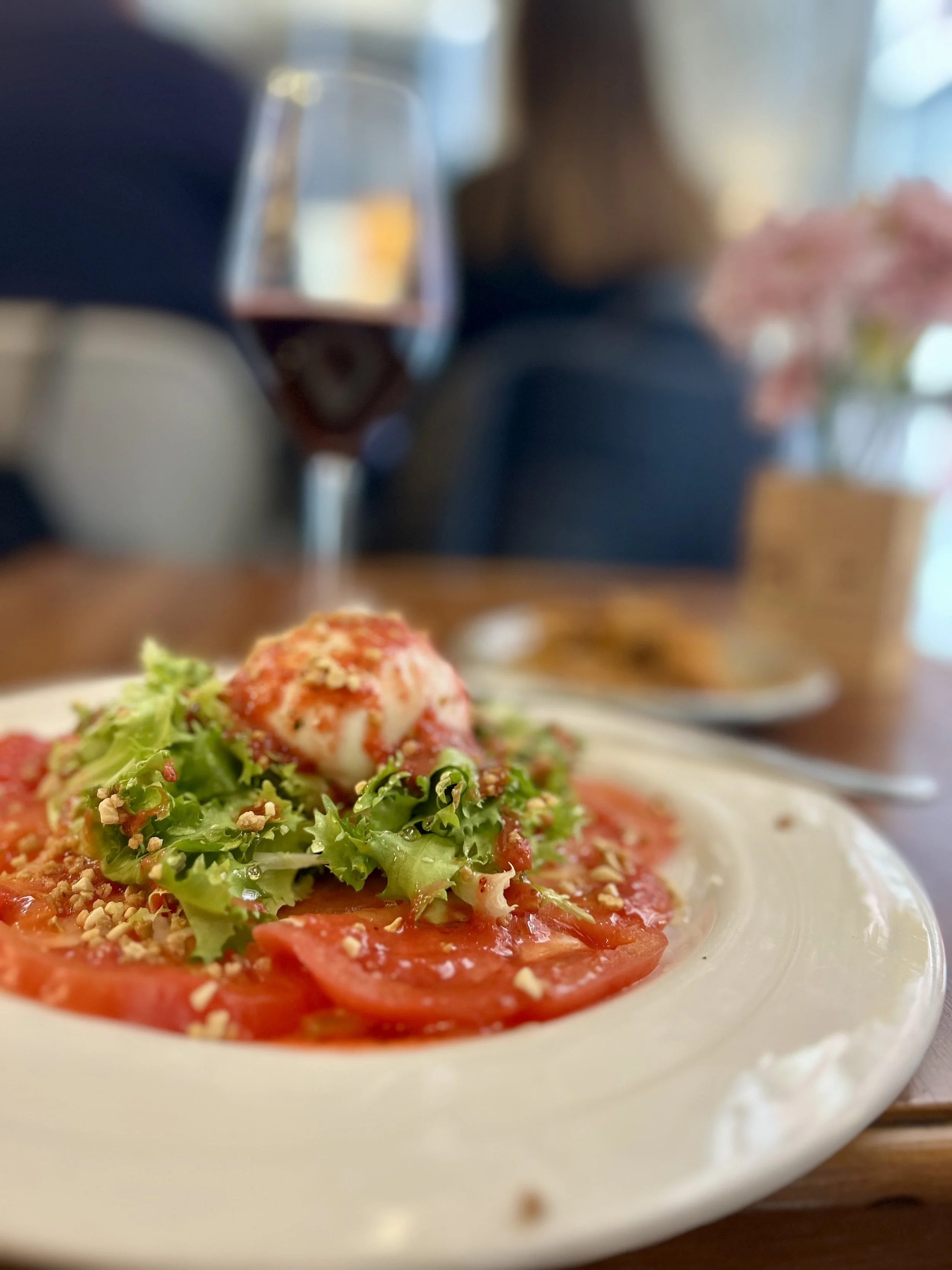 Tomatoes and burrata plate at La Telefonica in Granada, Spain