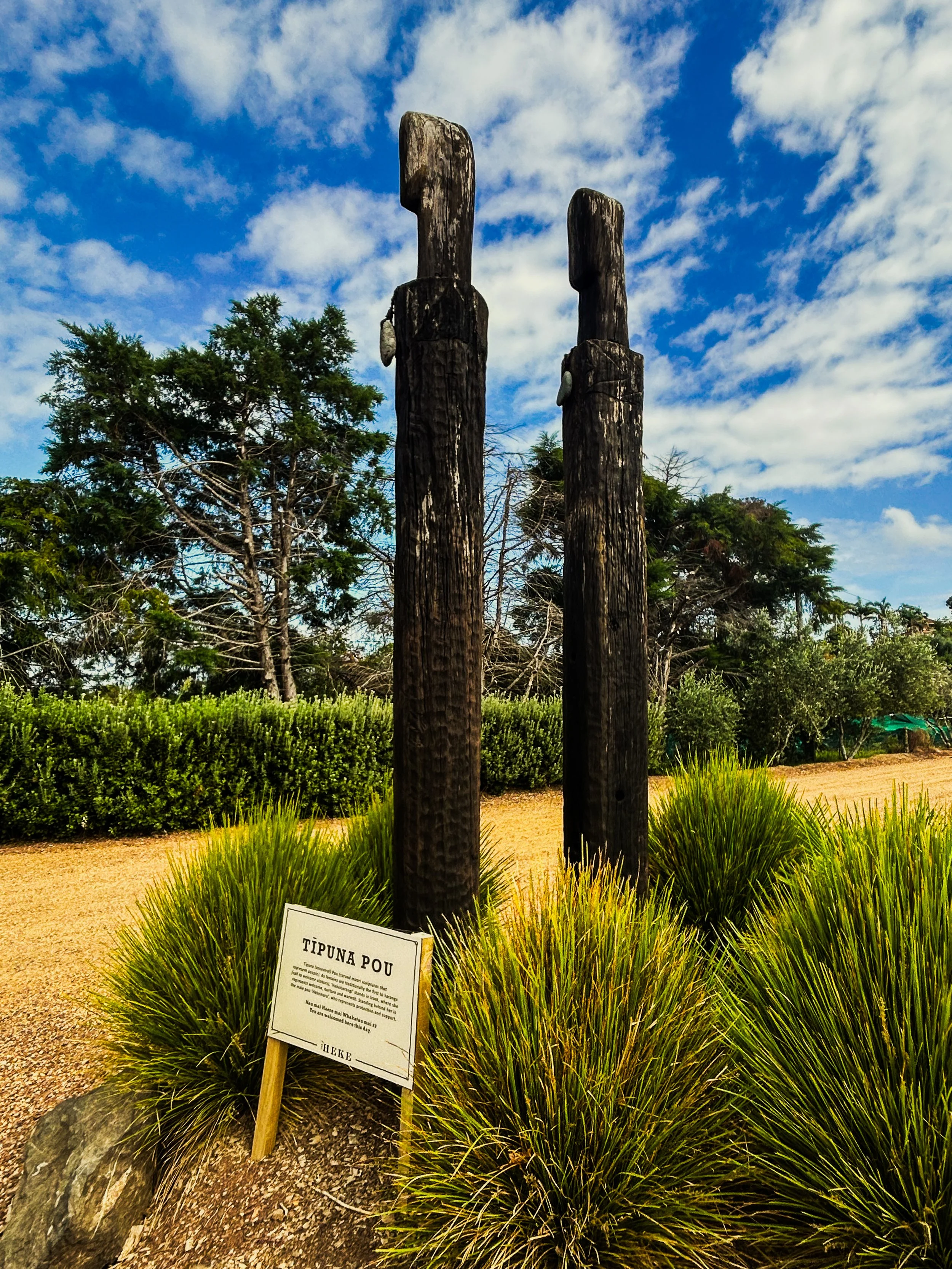 Wooden monuments outside of Heke Distillery on Waiheke Island