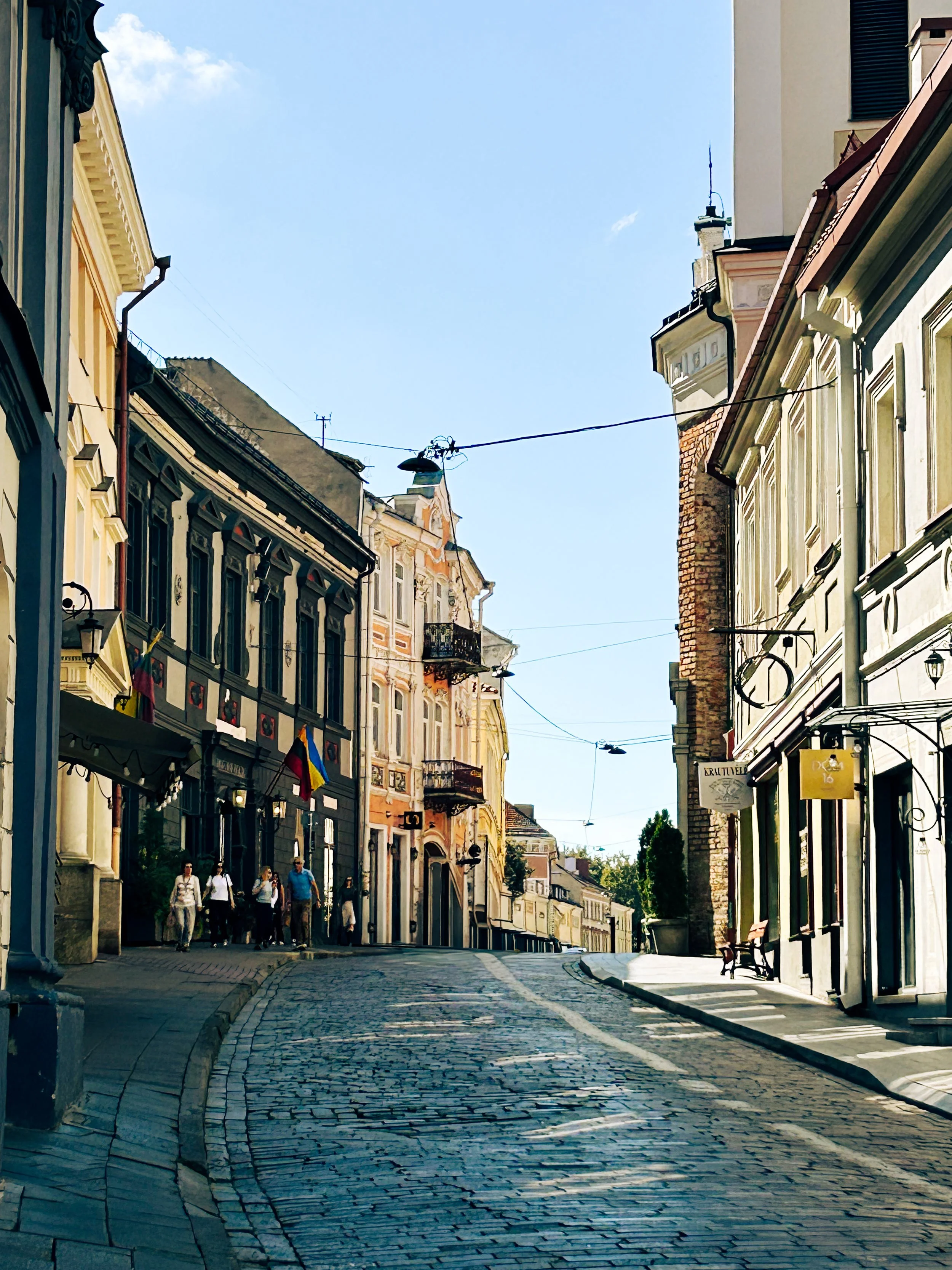 An old street flanked by old buildings in Vilnius, Lithuania