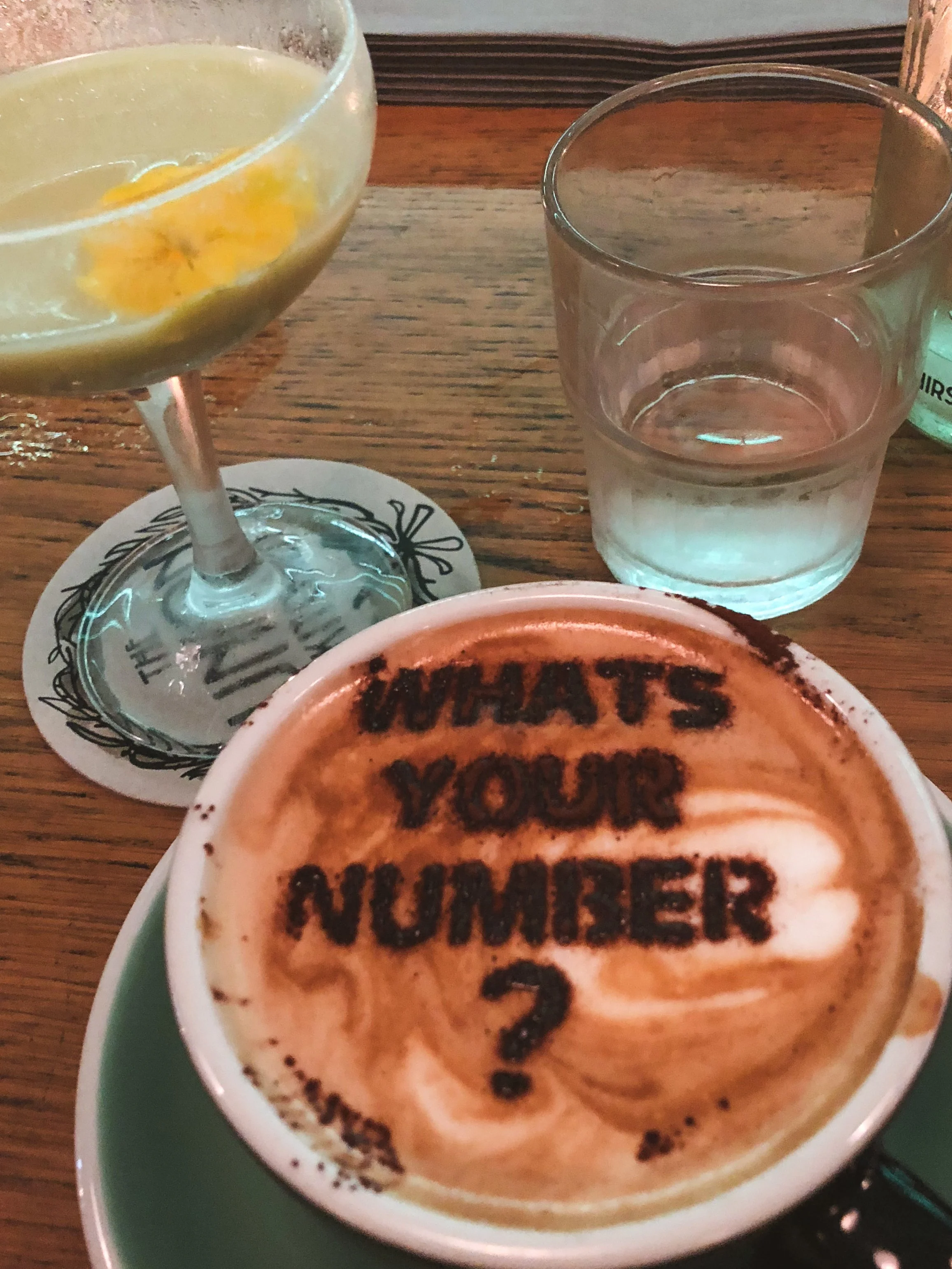Latte with What's Your Number? drawn in the foam at The Union Kitchen