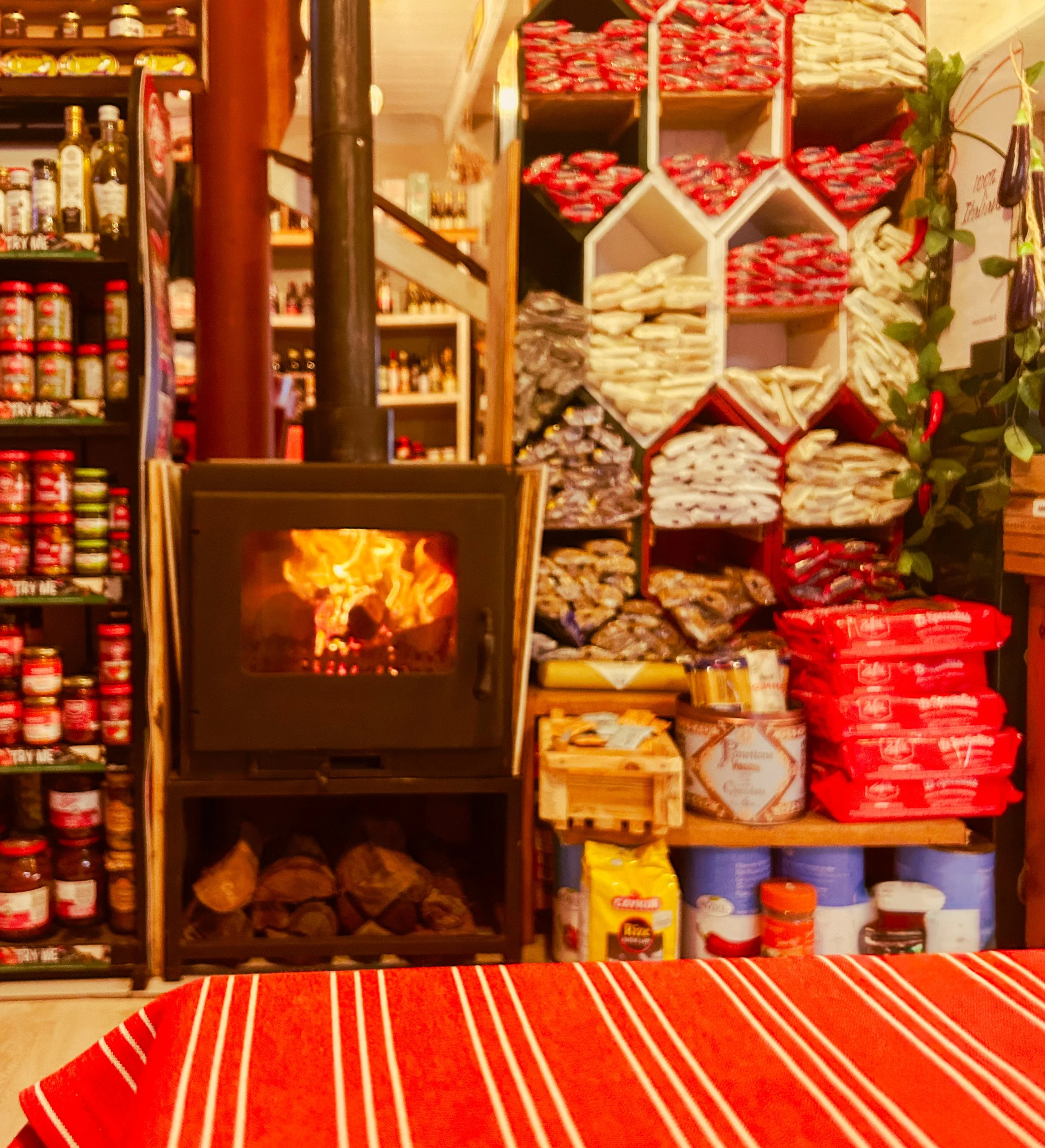 Cozy winter dining room with woodburning fireplace at Dal Italia in Hermanus, South Africa