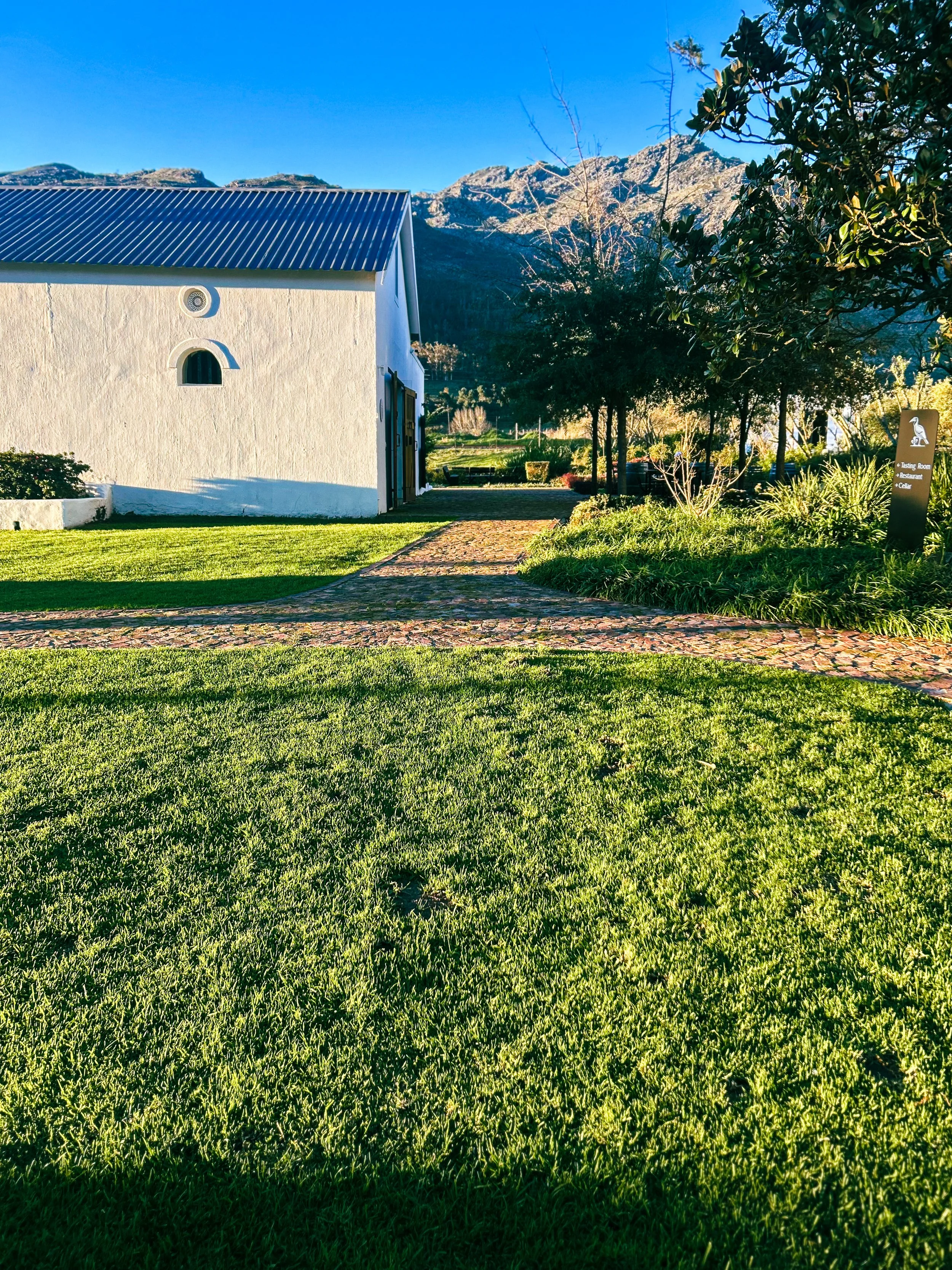 Klein Goederust in Franschhoek, South Africa, a white barn and grounds