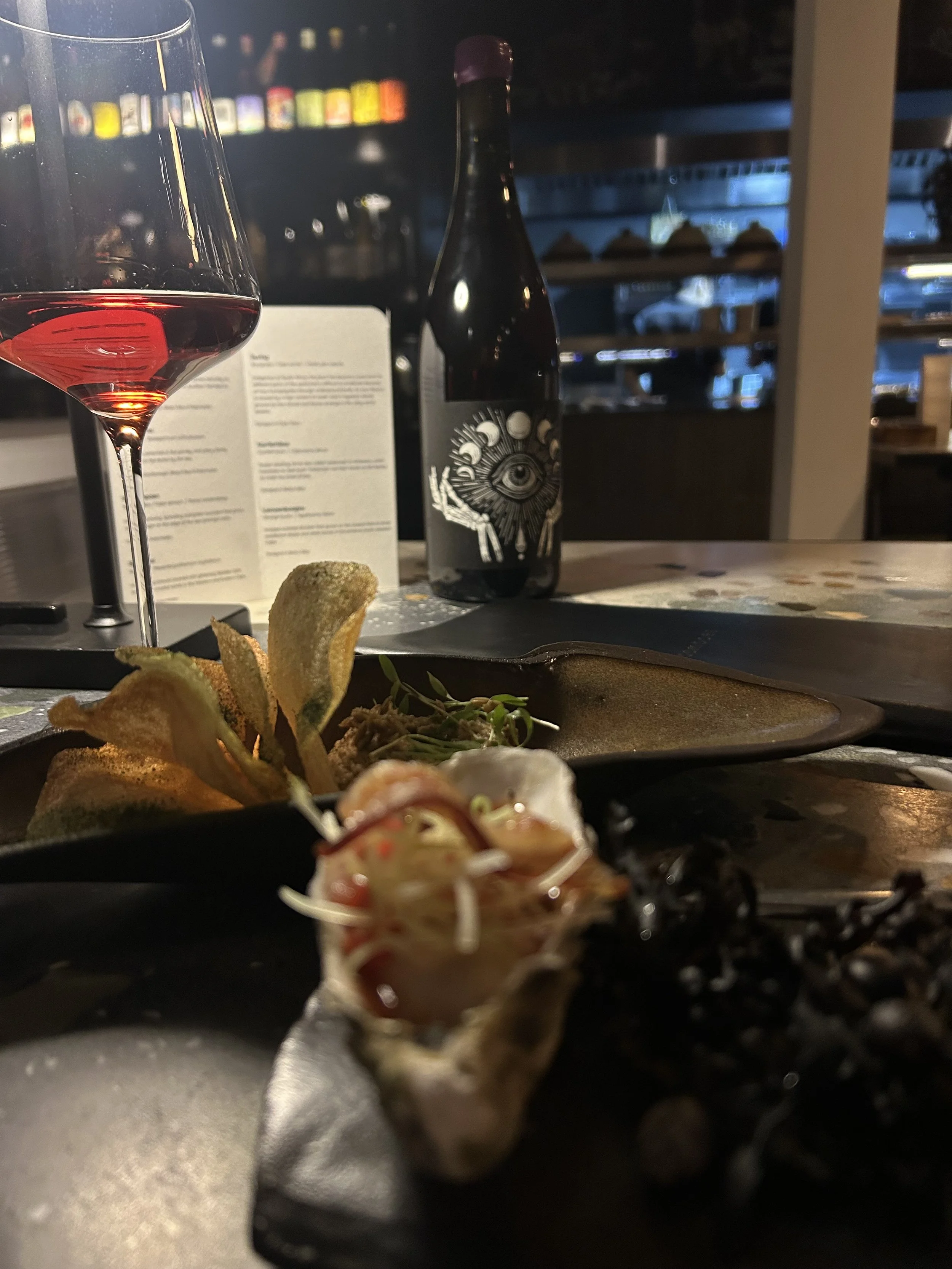 Bottle of The Blacksmith Wines tattoo label art at Seebamboes tasting in Cape Town South Africa