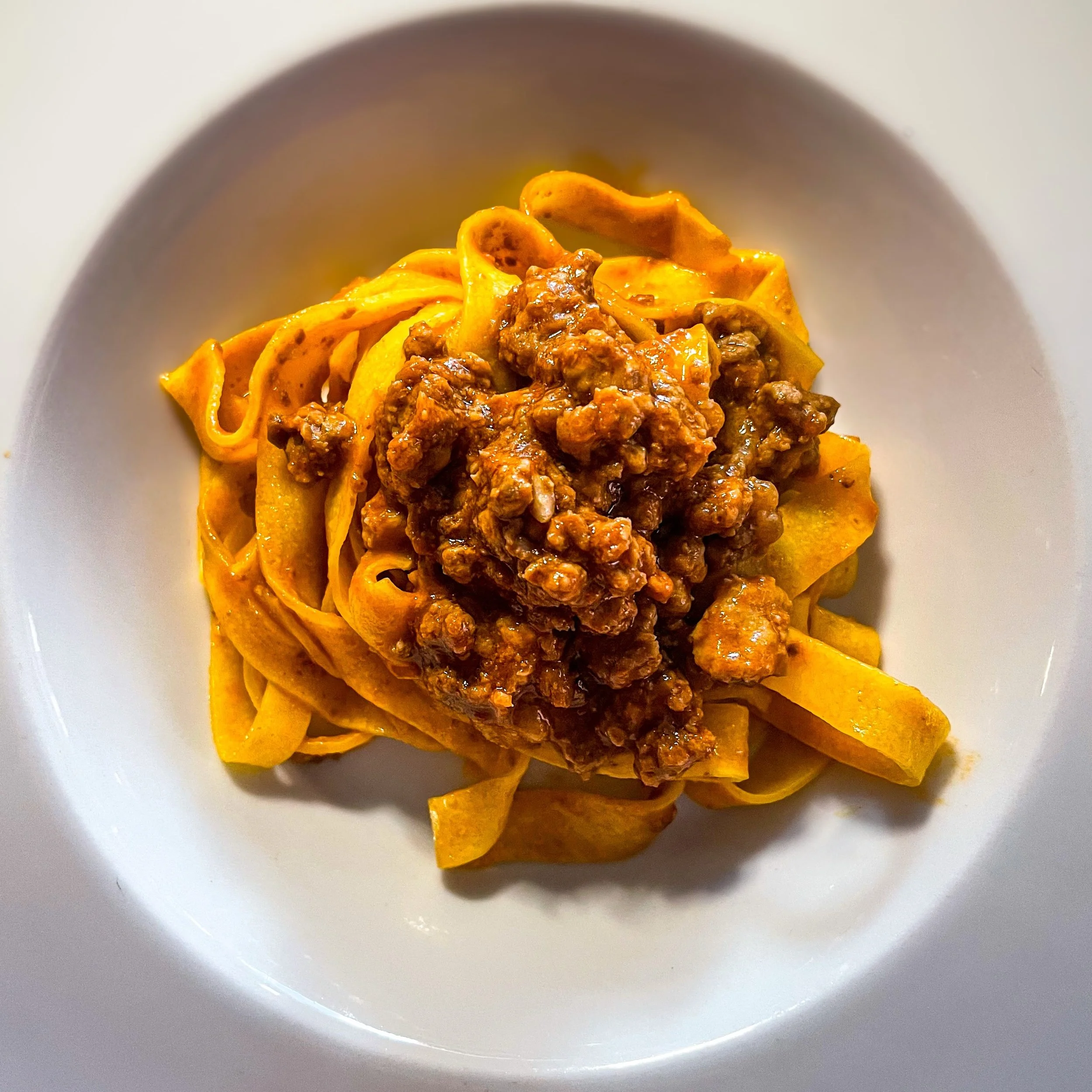PAIRINGS | Tessera x Taste
 "Its universal beauty is one thing, but its grip on my soul is altogether another." from Tessera Ed. 76 | St. Helena, CA USA 1992
 Paired with: Bolognese | Oltre | Bologna, Italy, 2021
 Travel is a journey | Not 