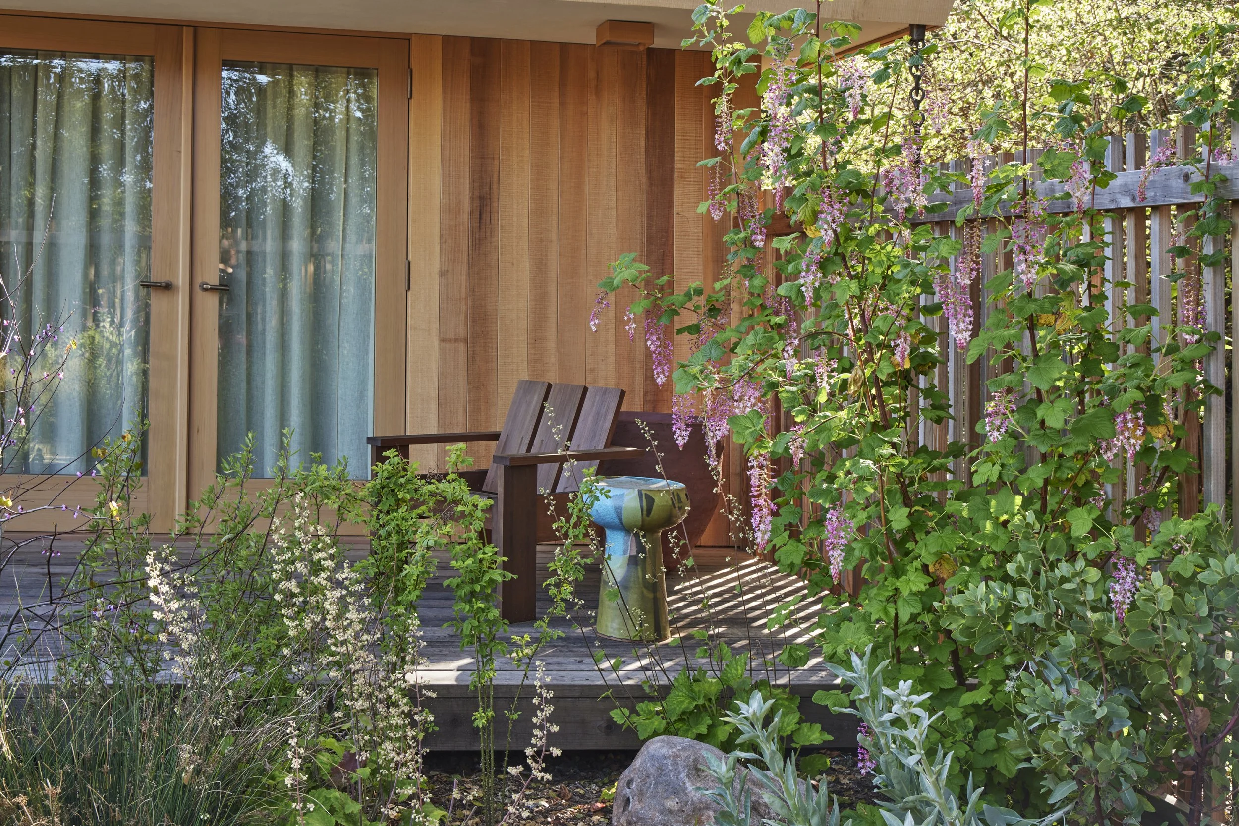 Rustic deck with potted plants and railing in Sausalito, CA