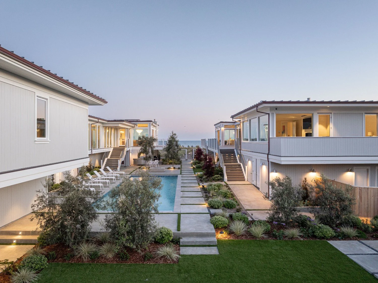 Landscape design, in-ground pool, and plantings by Heritage Landscapes