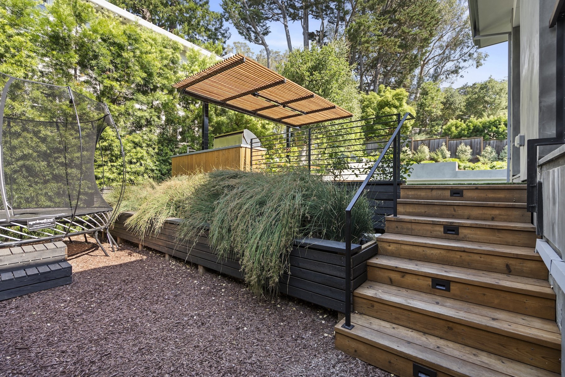 Backyard garden with wooden steps 
