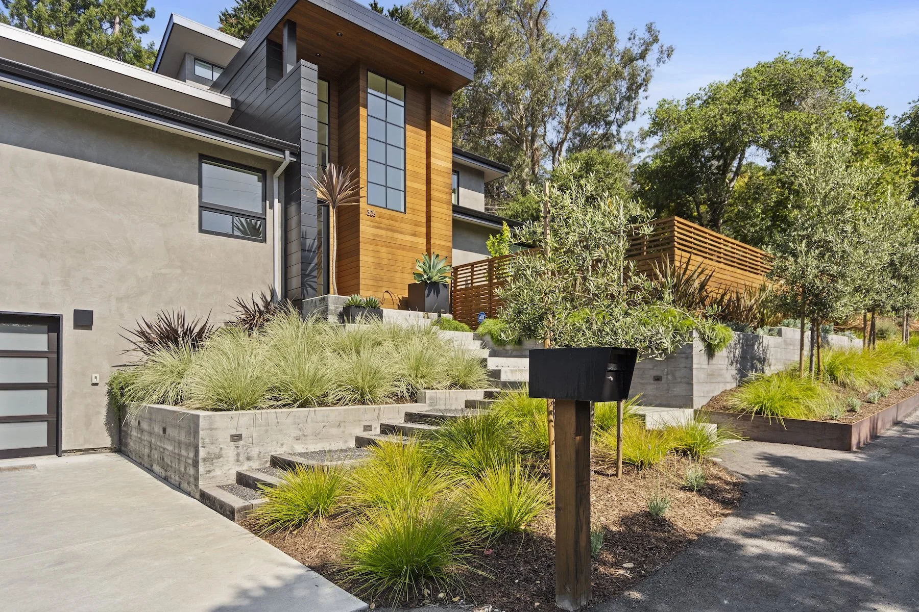 Front yard with raised garden beds, stone steps