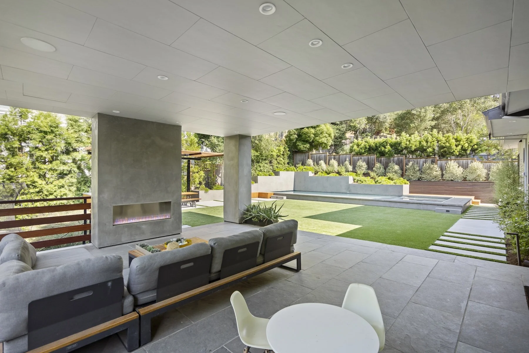 Covered patio with modern outdoor gas fireplace