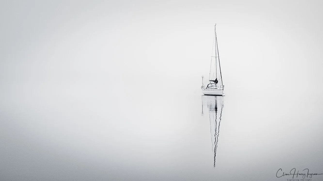 Photo by Clive Ingram - "I love the simplicity of this image — that beautiful use of negative space really draws you in. The placement of the boat using the rule of thirds is just perfect. It’s calm, balanced, and minimal in all the right ways. I abs