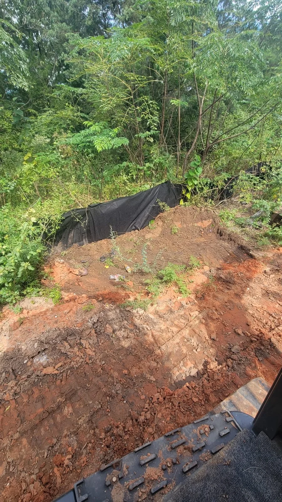 Erosion and sediment control, Mobile, AL — rip rap placed at the creek edge, Hughes 360 Services