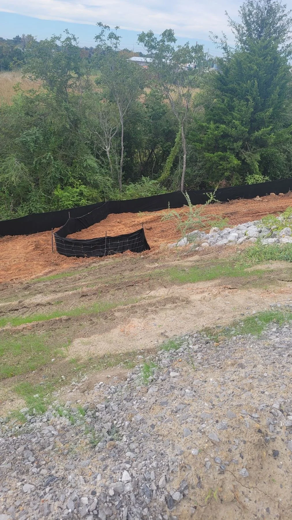 Erosion and sediment control, Mobile, AL — stabilized creek bank after work, Hughes 360 Services