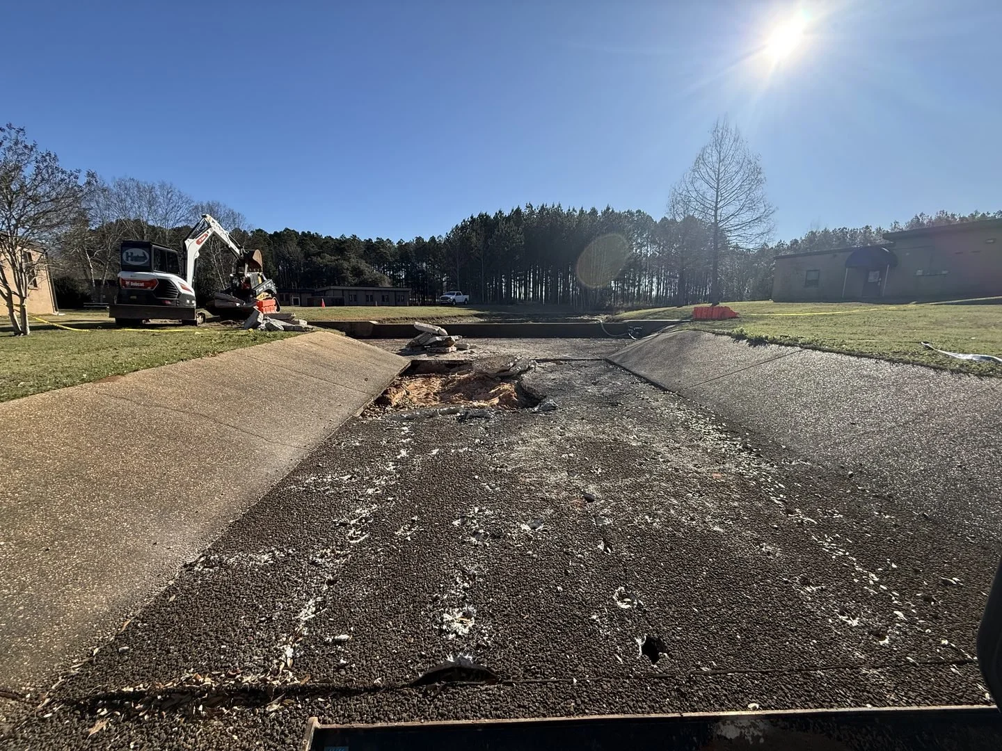 US Coast Guard Drainage Channel Repair — failed concrete channel floor before repair, Hughes 360 Services