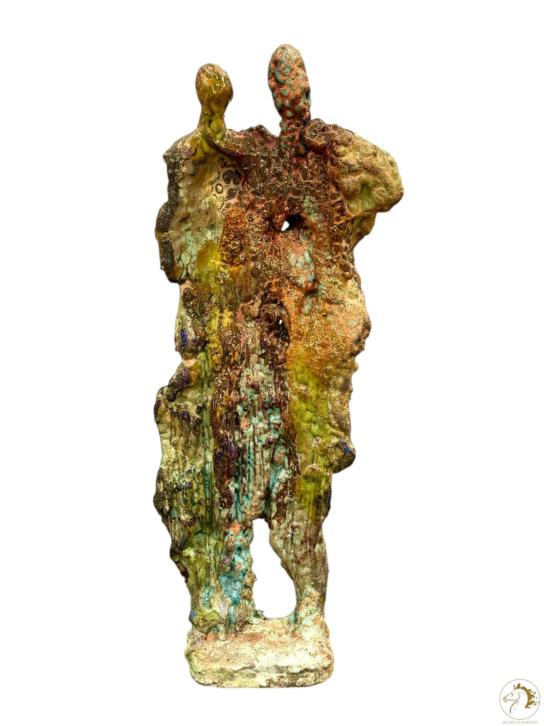 Colorful abstract sculpture resembling two figures, with a textured surface and a mix of vibrant colors including green, blue, yellow, orange, and brown.