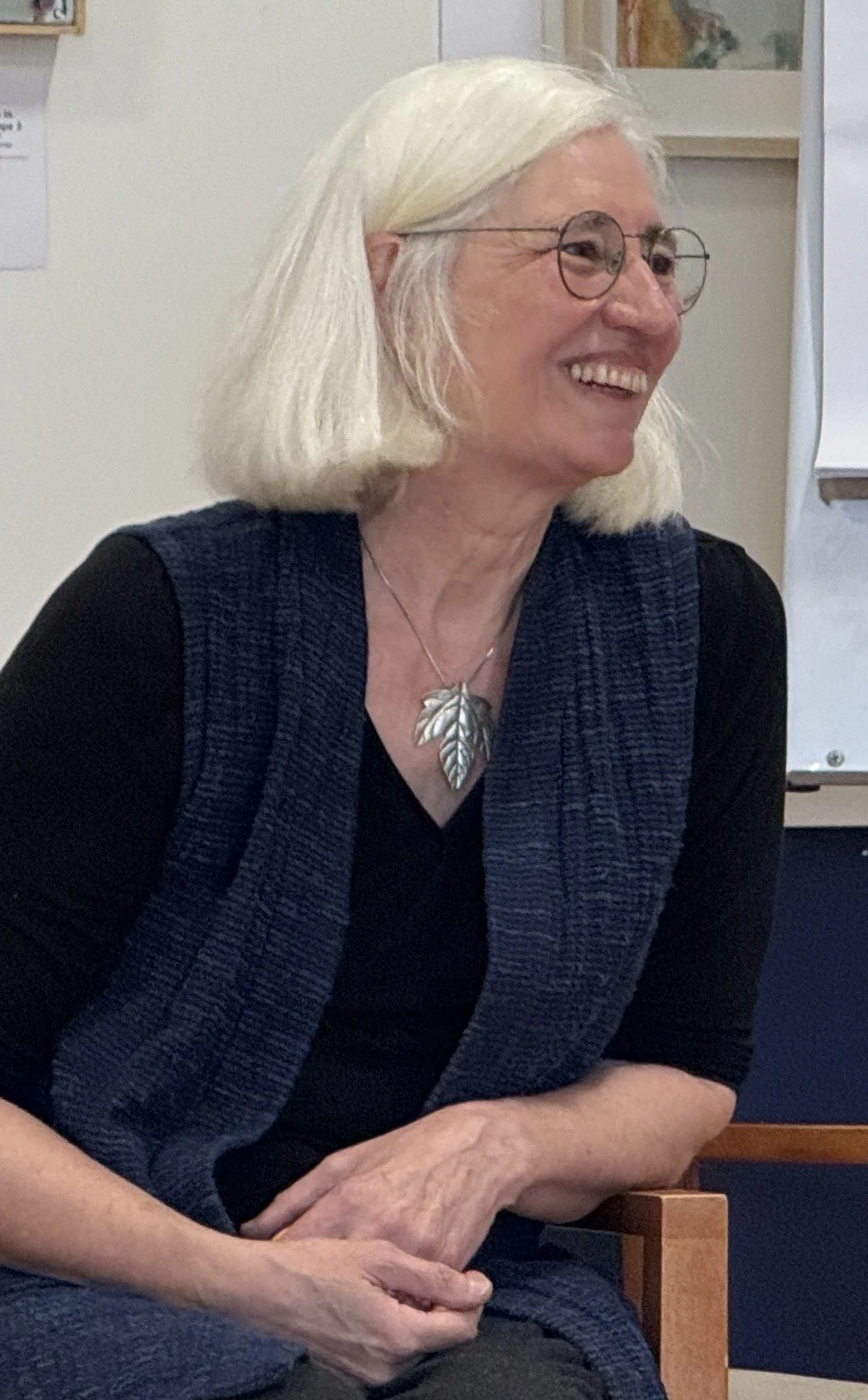 silver haired white woman smiling and relaxed