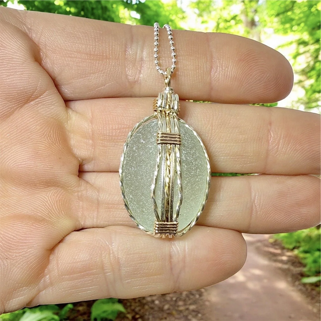 Wire wrapped necklace in sterling silver and 14k gold fill wire