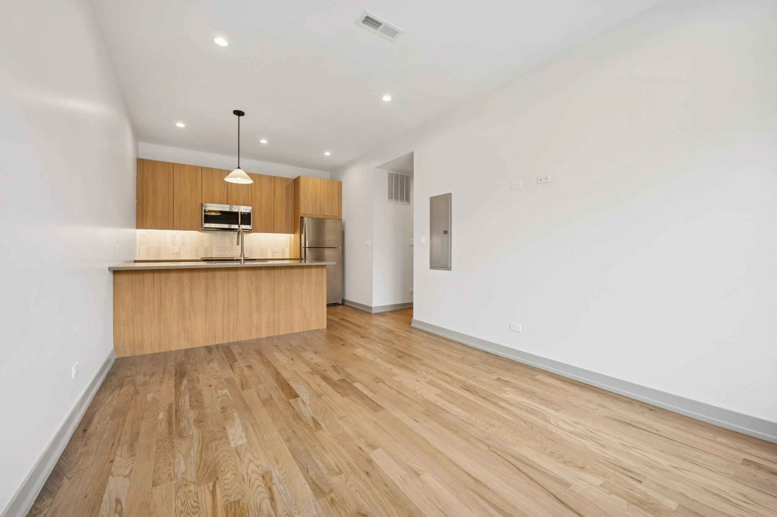 11_1331WEstesAve_Unit3A_91_KitchenLivingRoom_HiRes.jpg