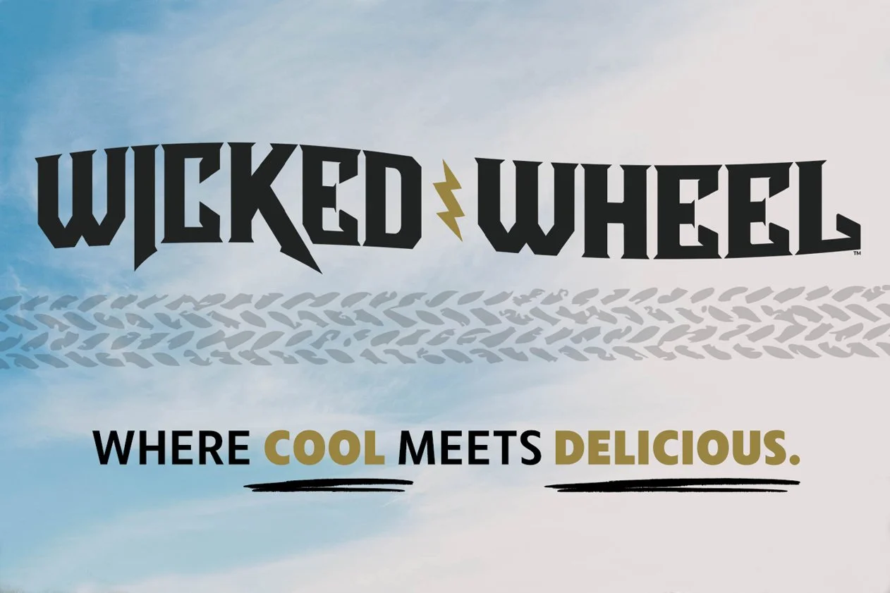 Image of Wicked Wheel Restaurant in Panama City Beach, FL logo.