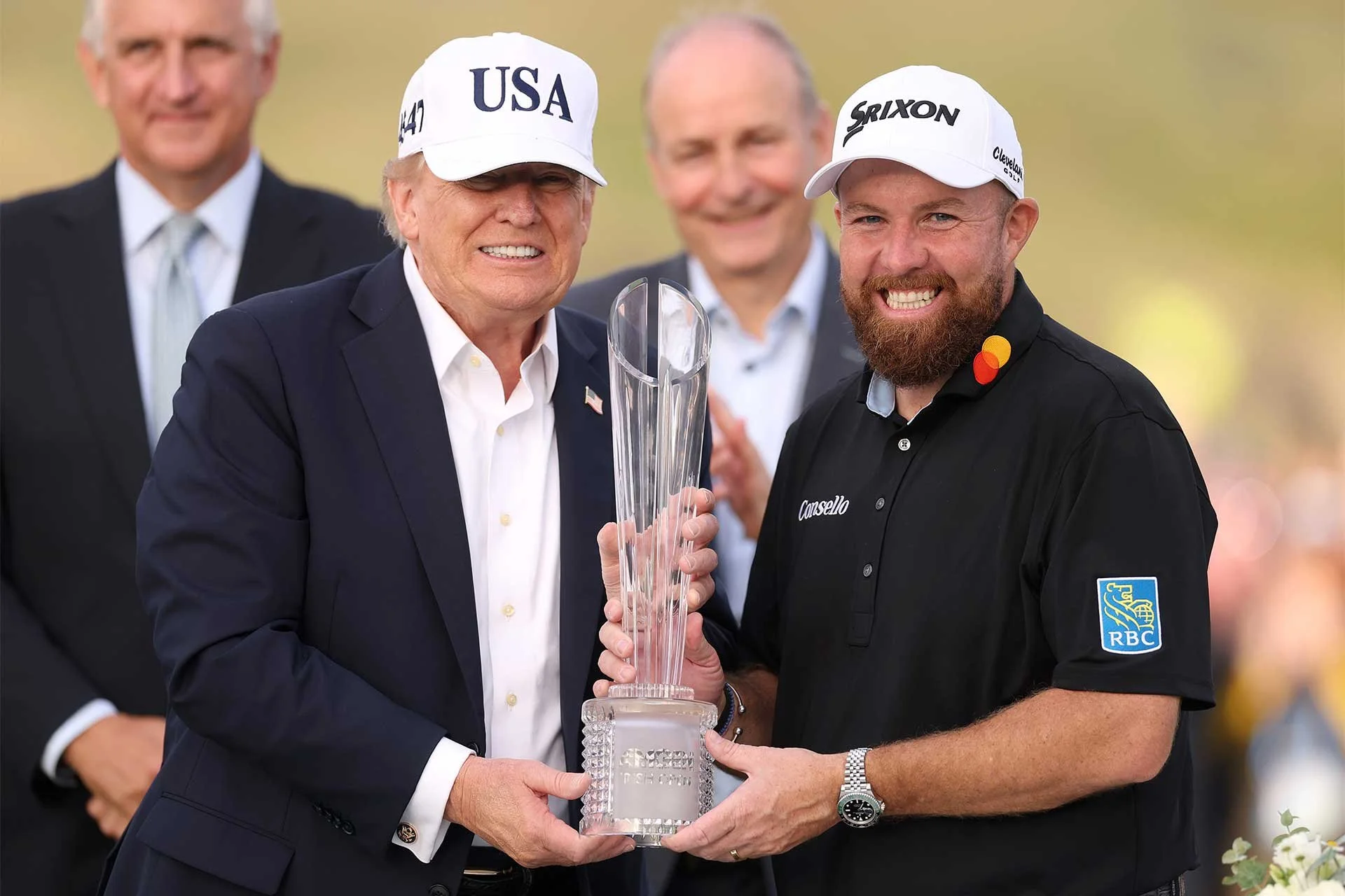 Amgen Irish Open winner Shane Lowry receives the trophy from US President Donald Trump. (Photo: Getty/Dp World Tour)
