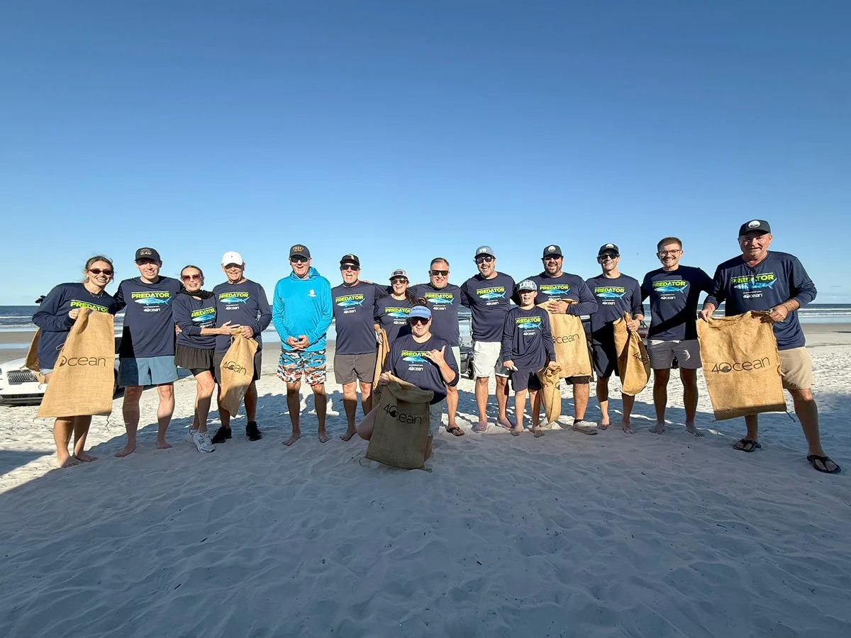 Group shot TrueTouch Floors Predator MonoTech launch and beach cleanup in partnership with 4ocean in New Smyrna Beach, Florida