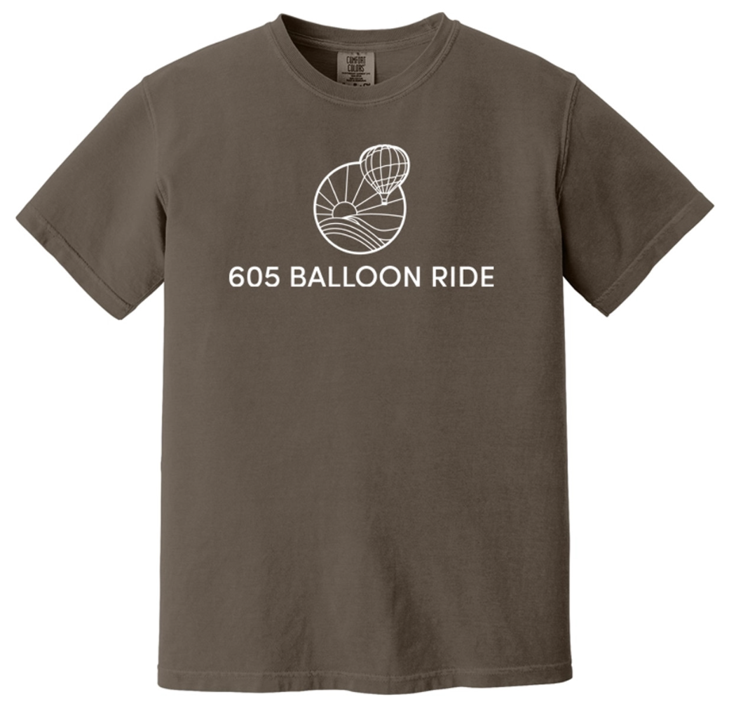 Brown T-shirt with a graphic of a hot air balloon and sun over hills, and the text '605 Balloon Ride'.