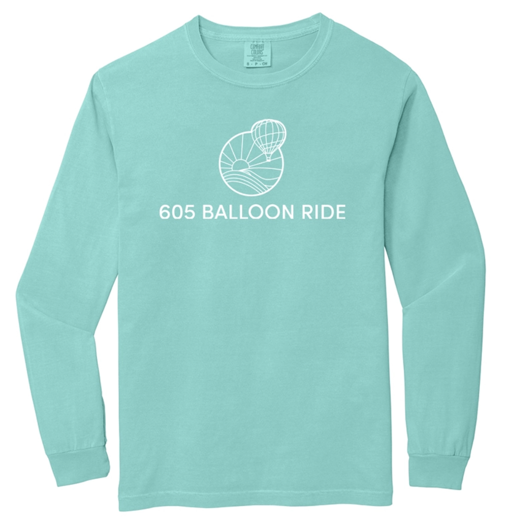 A turquoise long-sleeve shirt with a white outline of a hot air balloon over a landscape and the text '605 BALLOON RIDE' printed below the graphic.