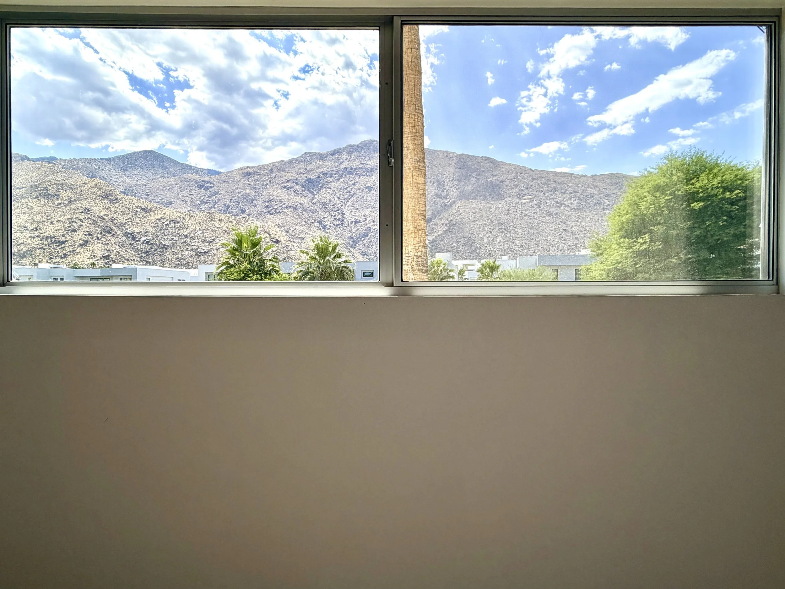 5. light filled bedroom desert condo.jpeg