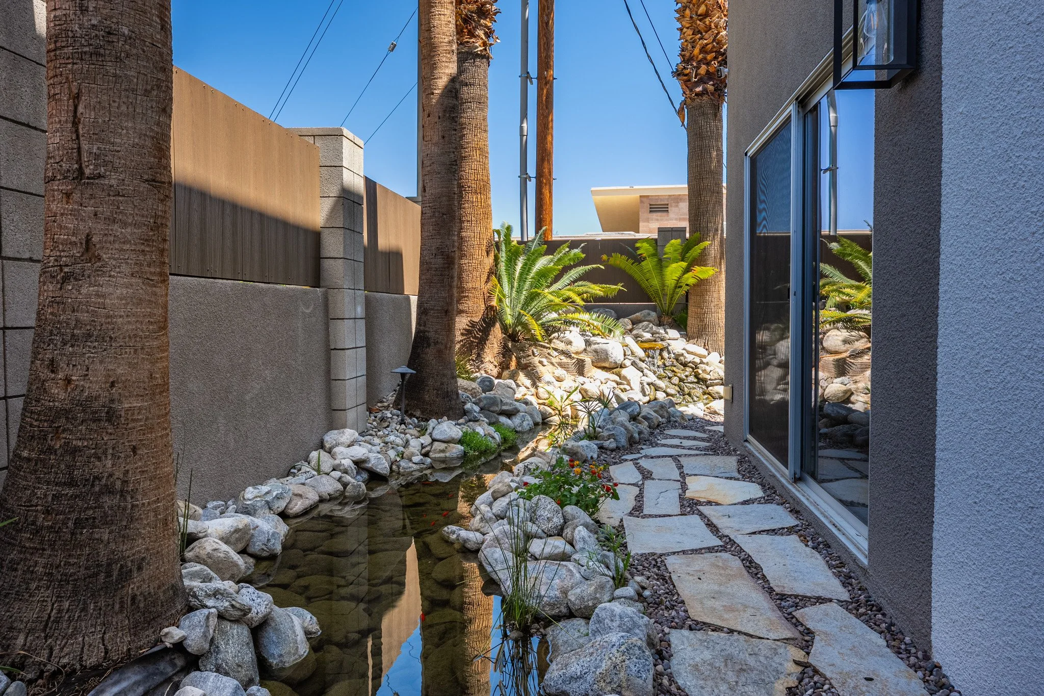 34 palm-springs-condo-private-backyard-lush-landscaping-querencia-palms.jpg