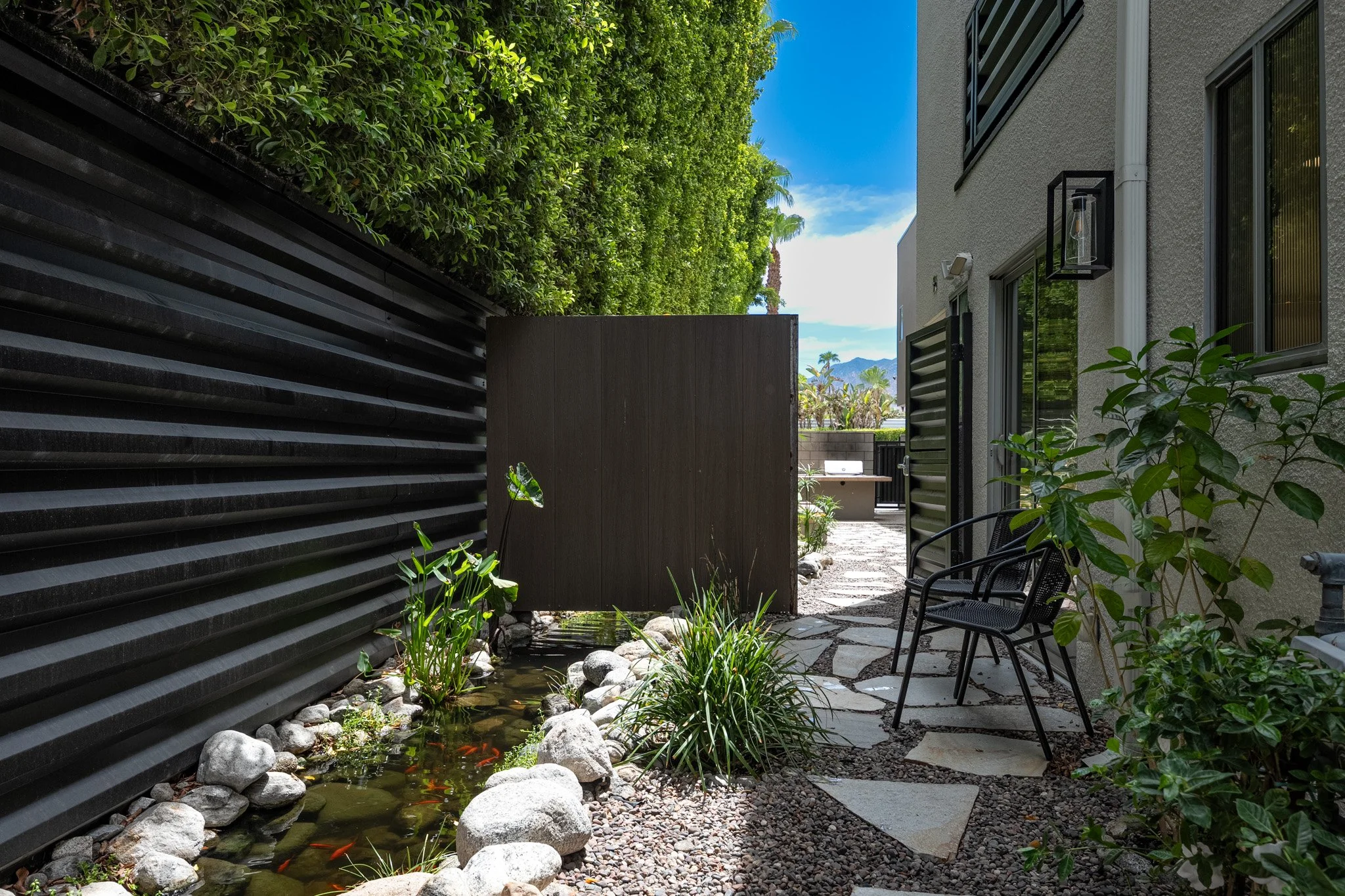 23 querencia-palms-condo-for-sale-koi-pond-landscaping.jpg