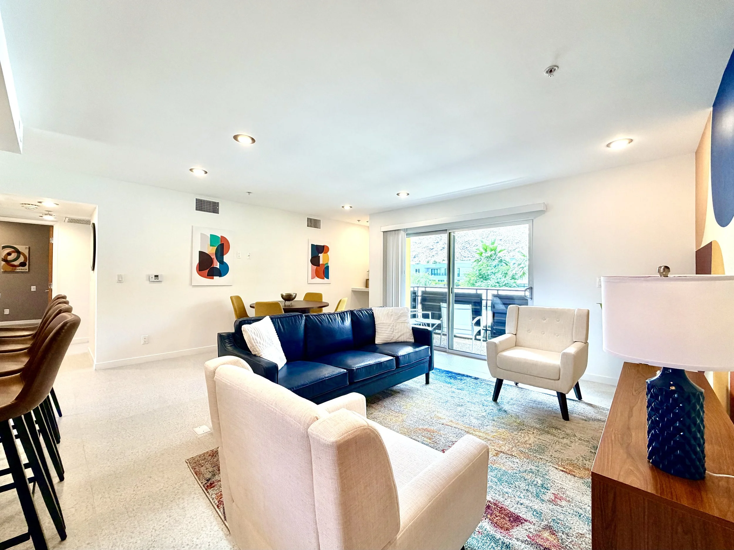 4. bright living room space with balcony access.jpeg