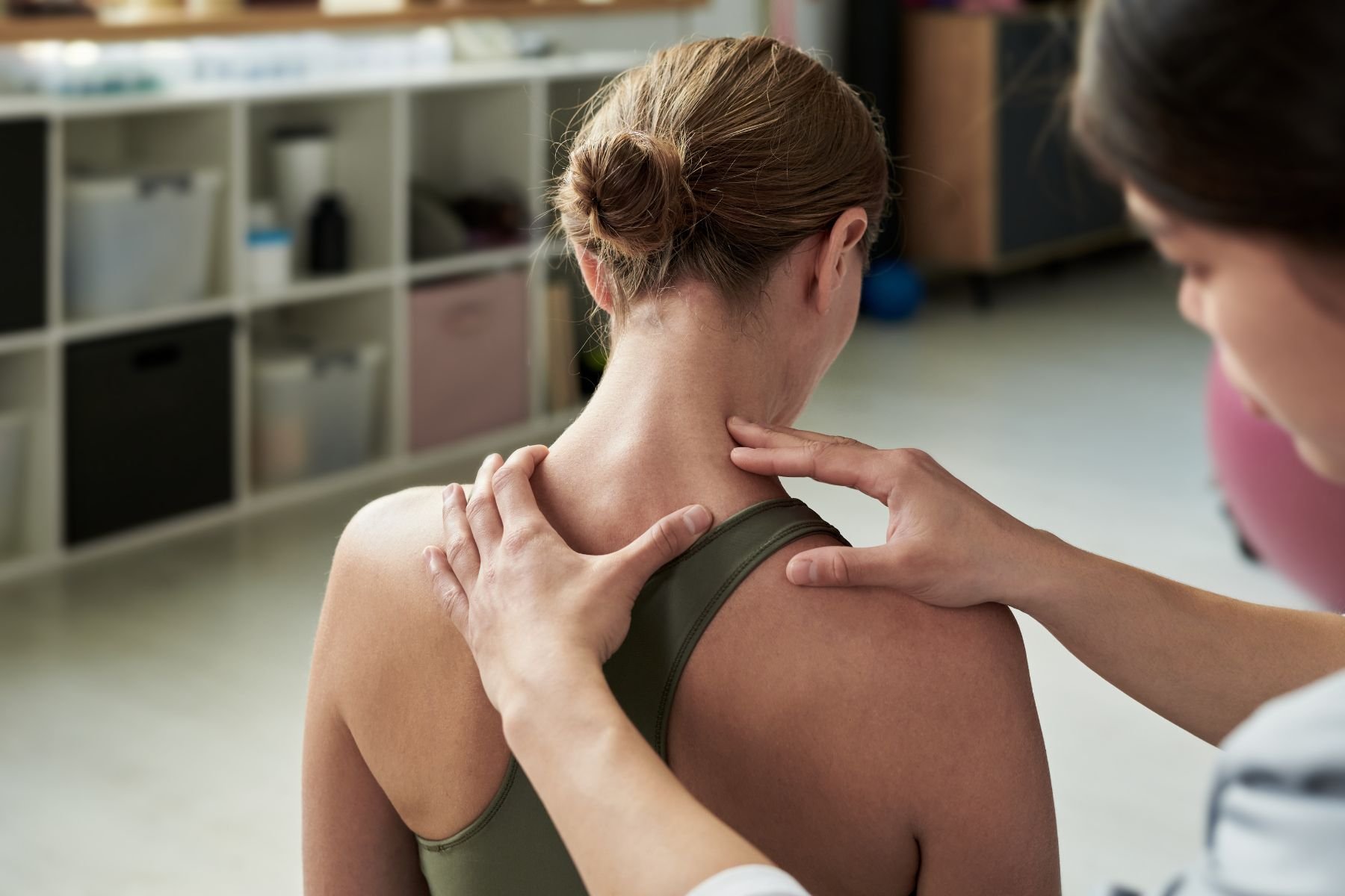 Physiotherapist performing a neck screening assessment before BPPV repositioning treatment in London, Ontario