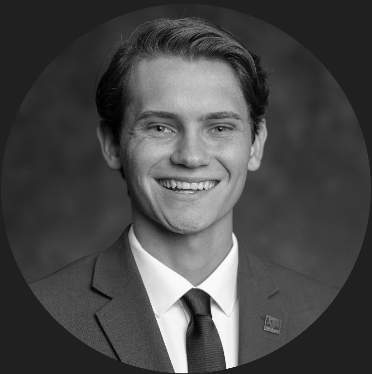 Nighttime landscape with a mountain silhouette, calm water, and a star-filled sky with a bright planet or star at the center.