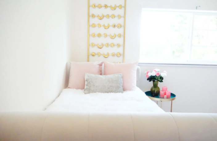 Pink and gold guest room at the Venusian