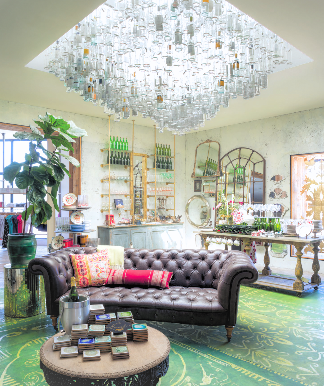 This concept used 500 wine bottles, hung en masse, to crown this dining concept for, Anthropologie.